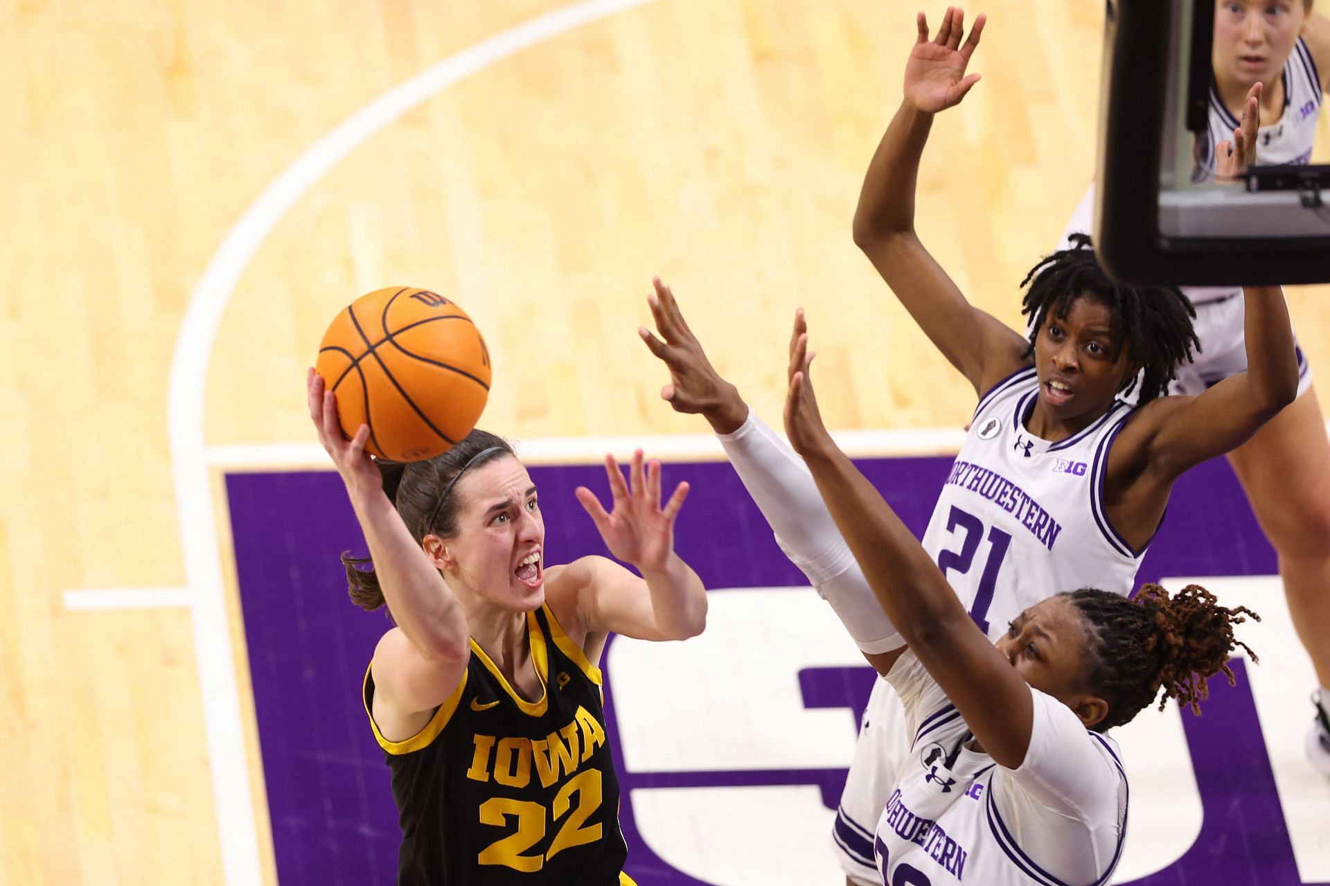 Caitlin Clark of the Iowa Hawkeyes shoots against the Northwestern Wildcats.