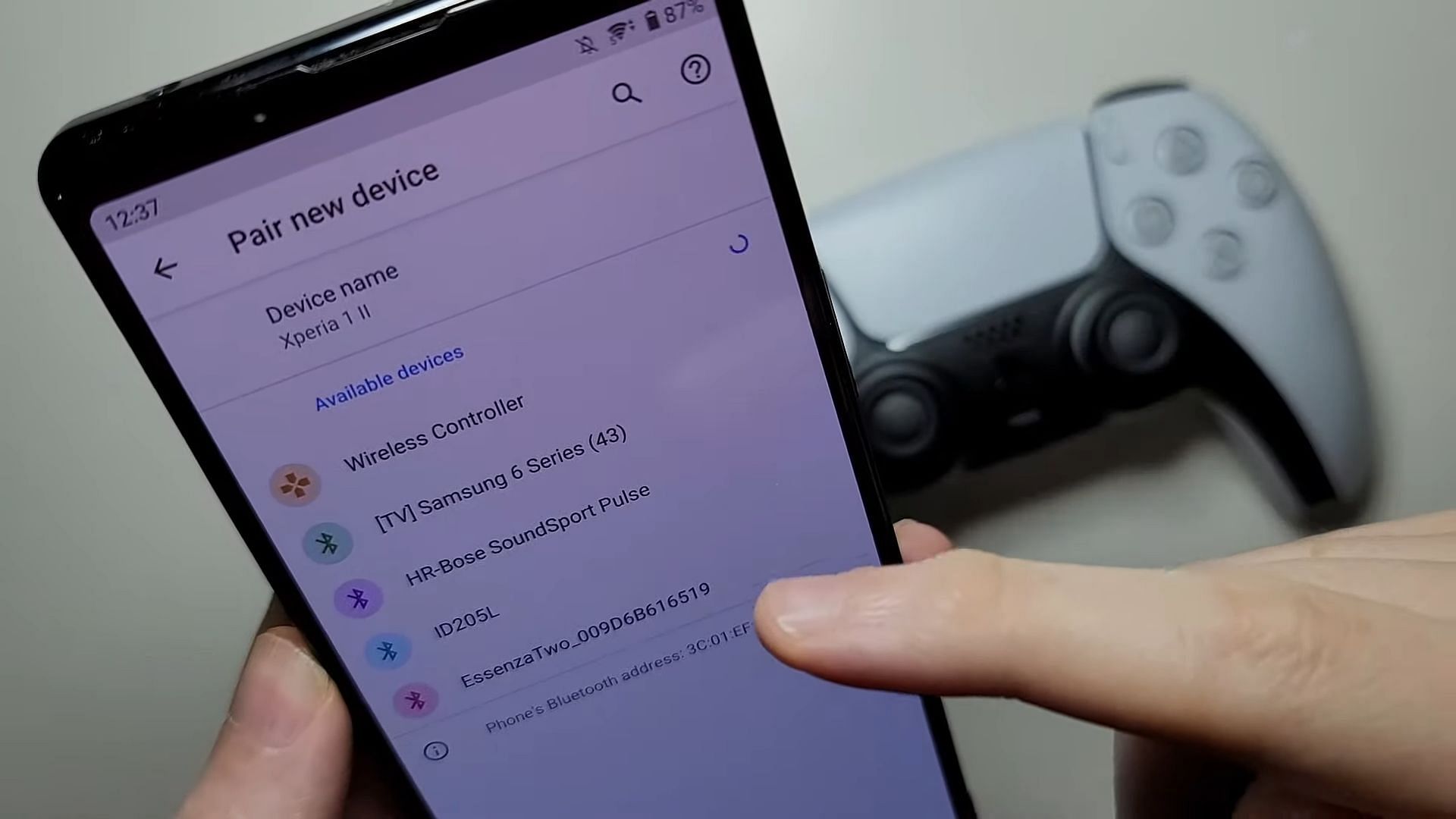 Bluetooth pairing PS5 controller (Image via Phone Battles/YouTube)