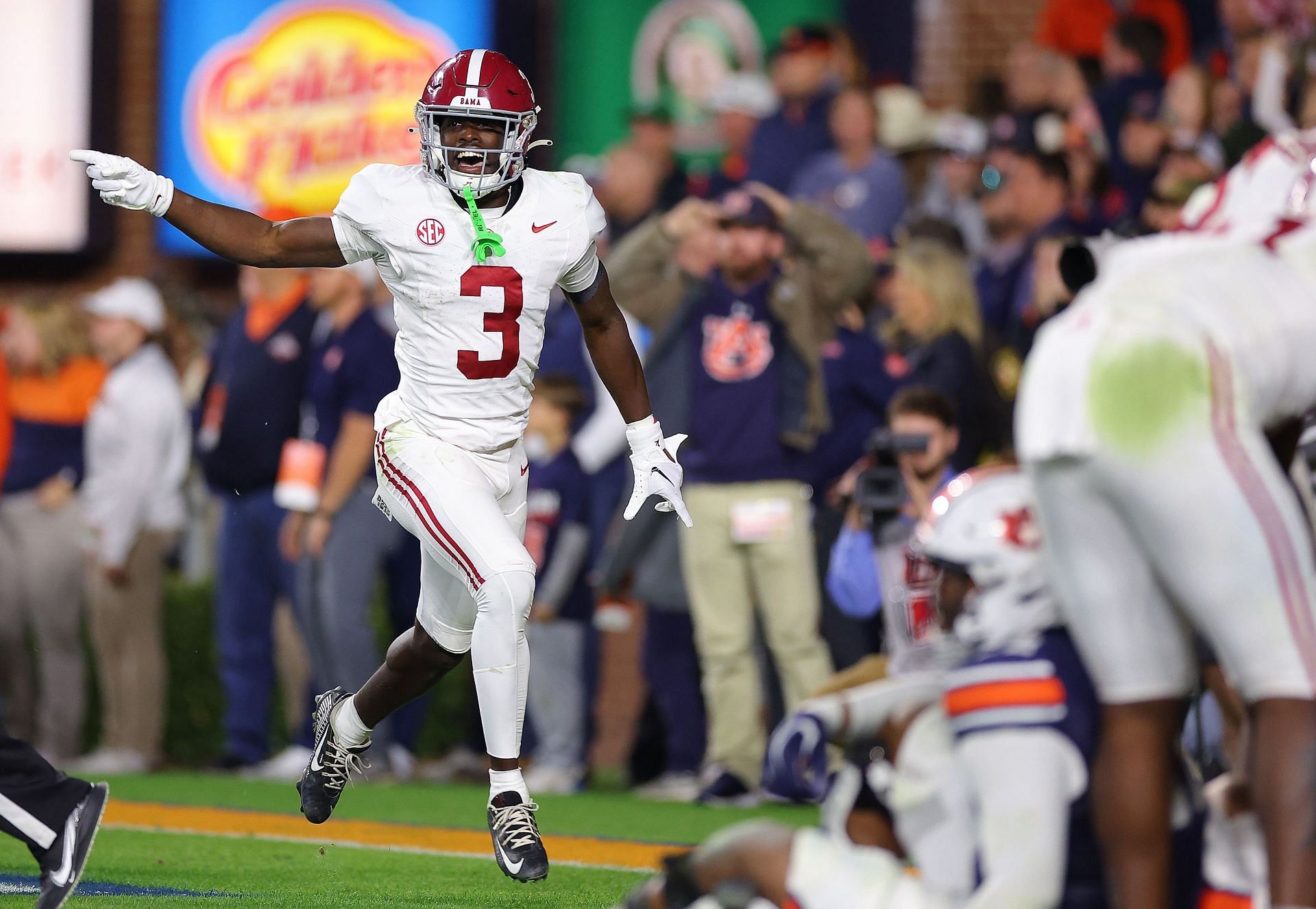 Terrion Arnold #3 of the Alabama Crimson Tide reacts after intercepting the final pass of the game in their 27-24 win over the Auburn Tigers