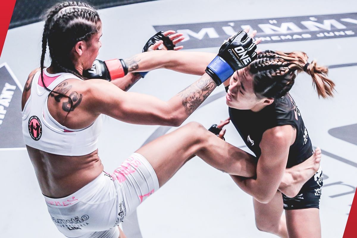 Angela Lee (right) throws a punch against Istela Nunes (left) [Photo via: ONE Championship]