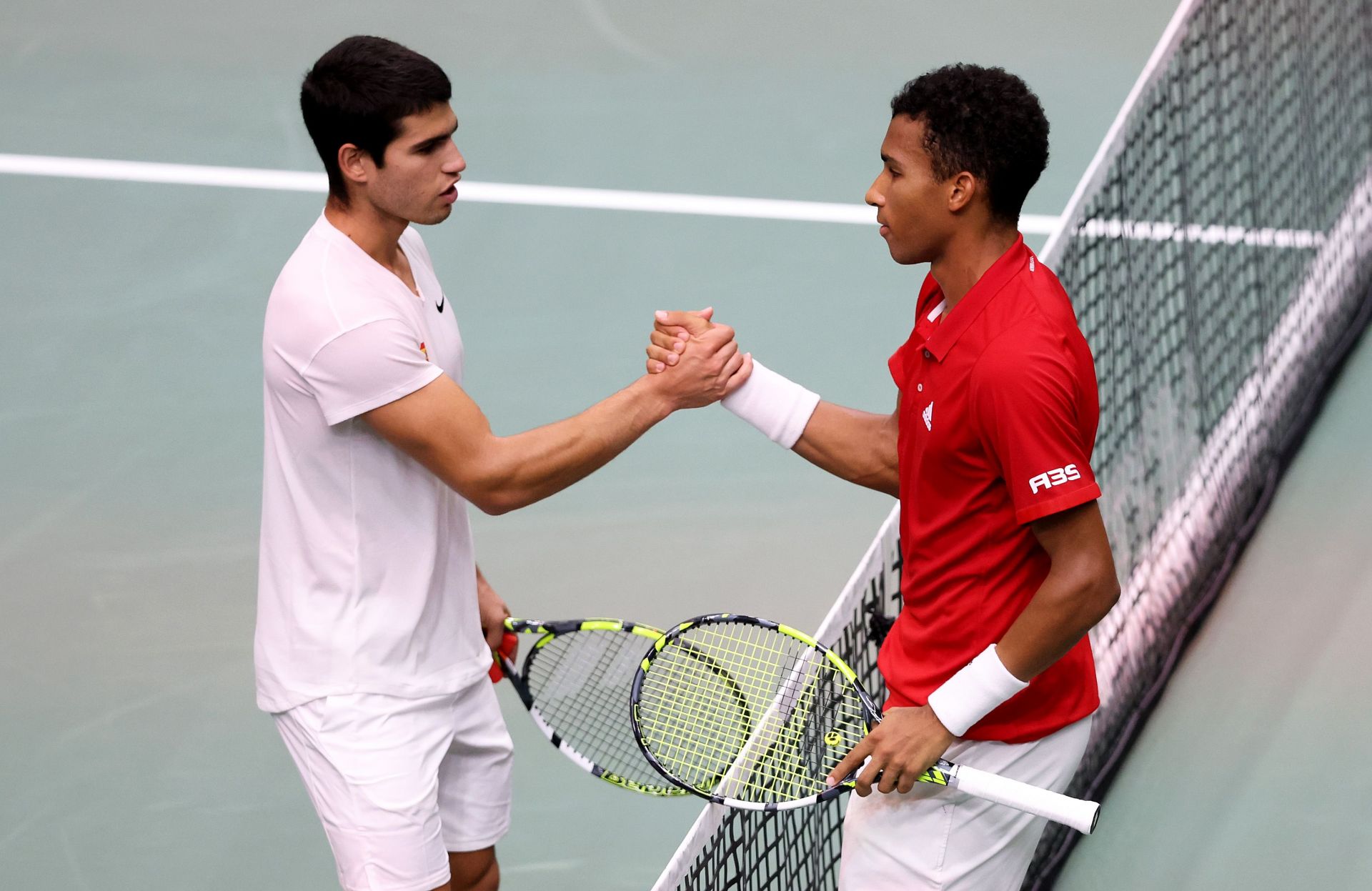 Carlos Alcaraz and Felix Auger-Aliassime greet each other at Davis Cup