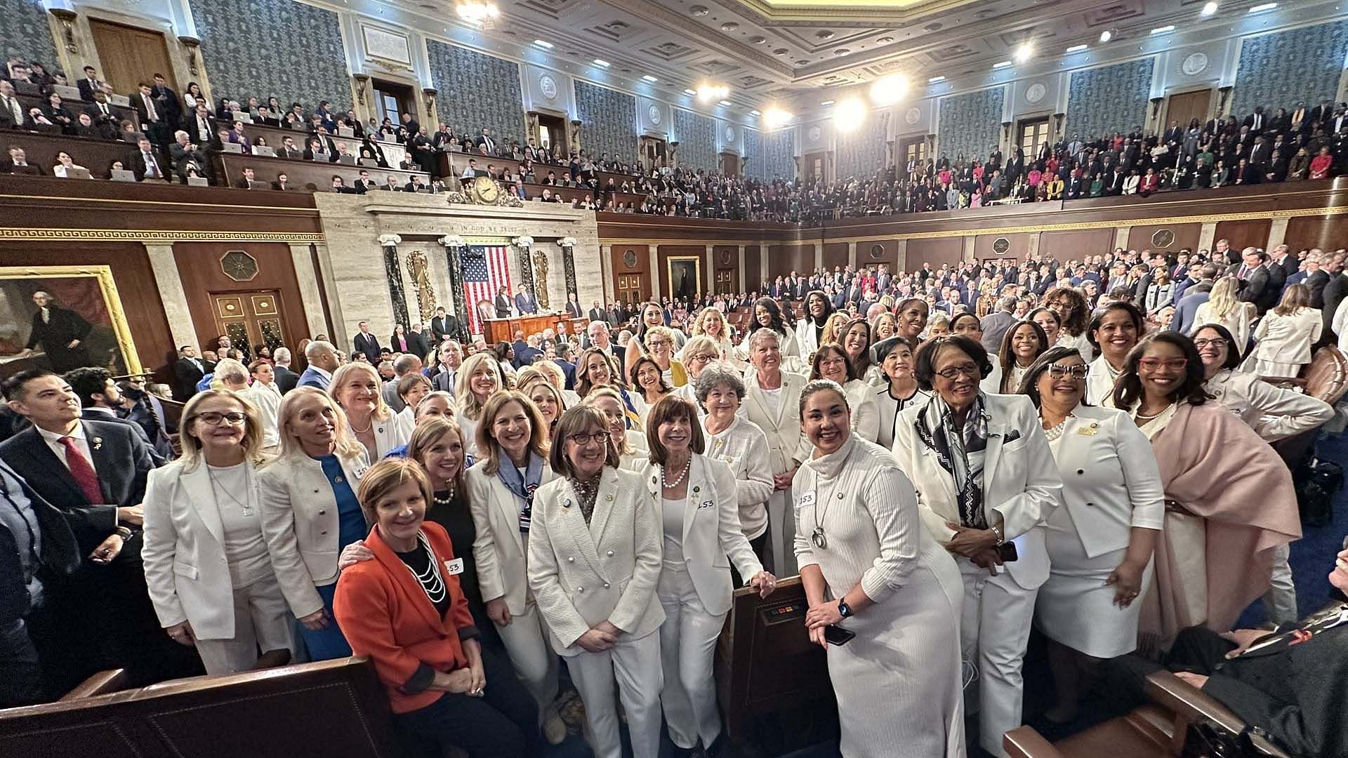 Democratic Congresswomen don white during Biden