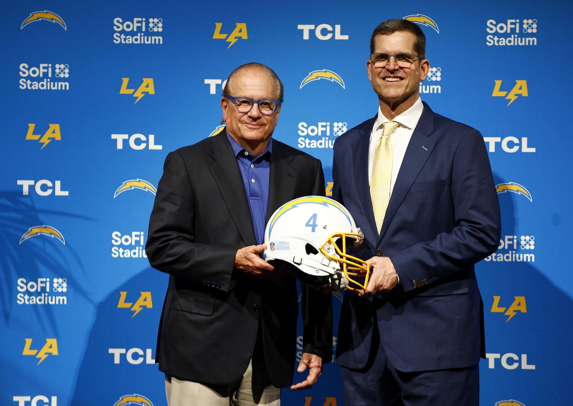 Owner Dean Spanos and coach Jim Harbaugh