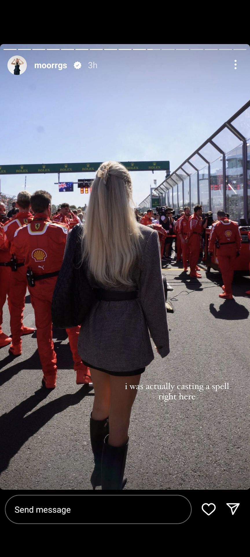 Riddle standing behind the Ferrari team at the Australian Grand Prix