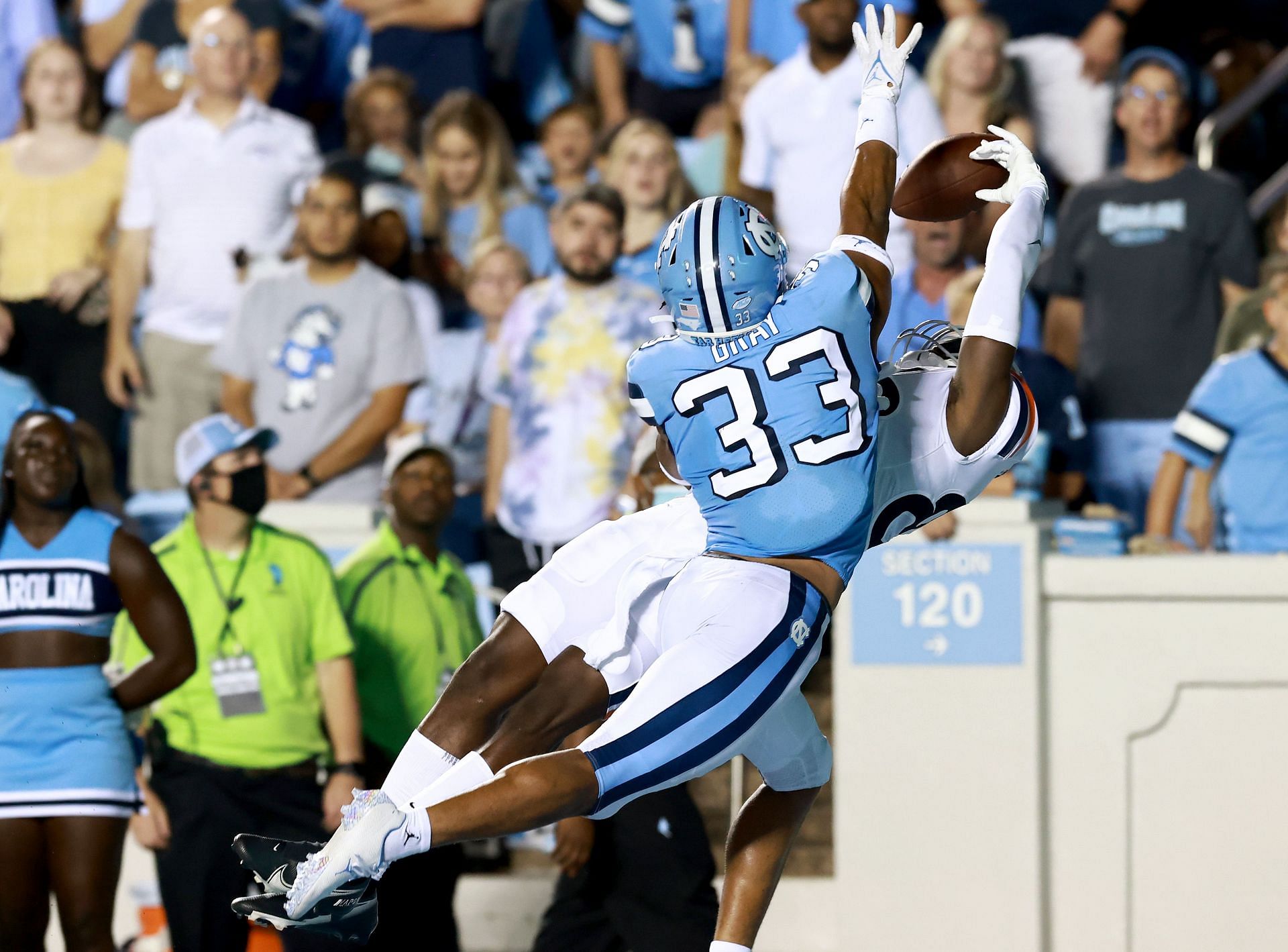 Cedric Gray #33 of the North Carolina Tar Heels defends a pass to Malachi Fields #86 of the Virginia Cavaliers
