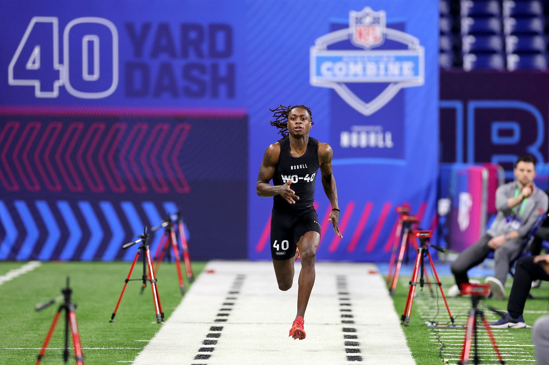 Xavier Worthy #WO40 of Texas participates in the 40-yard dash during the NFL Combine.