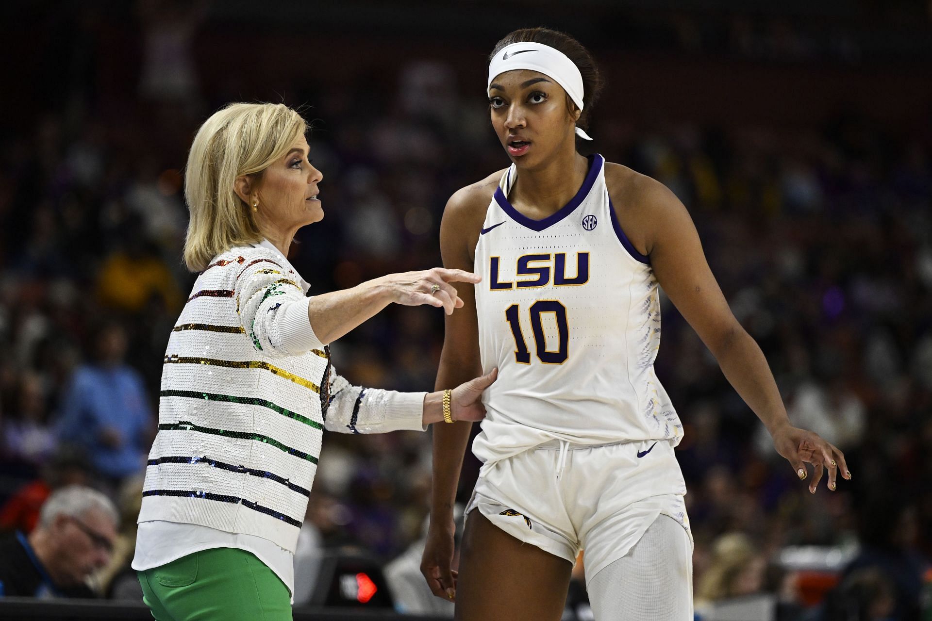 LSU coach Kim Mulkey gives instructions to LSU superstar Angel Reese.