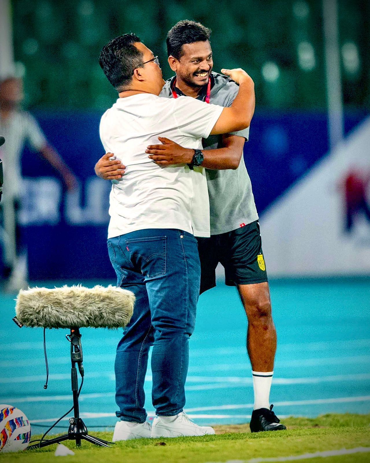 Hyderabad FC coaches Thangboi Singto and Shameel Chembakath hugging each other after the game.
