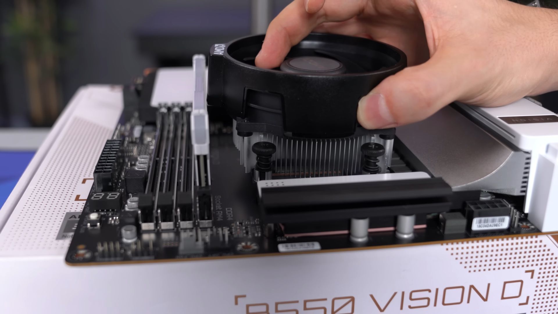 Installing the CPU cooler (Image via TechSource/YouTube)