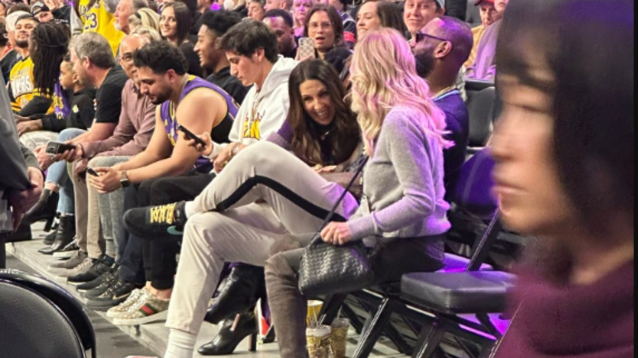 LeBron James sat between Linda Rambis and Jeanie Buss during a lull in the Milwaukee Bucks-LA Lakers game on Friday. (photo by: Dave McMenamin)