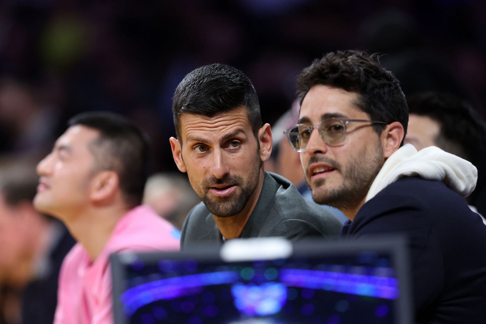 Novak Djokovic (center) at the Golden State Warriors v Los Angeles Lakers game