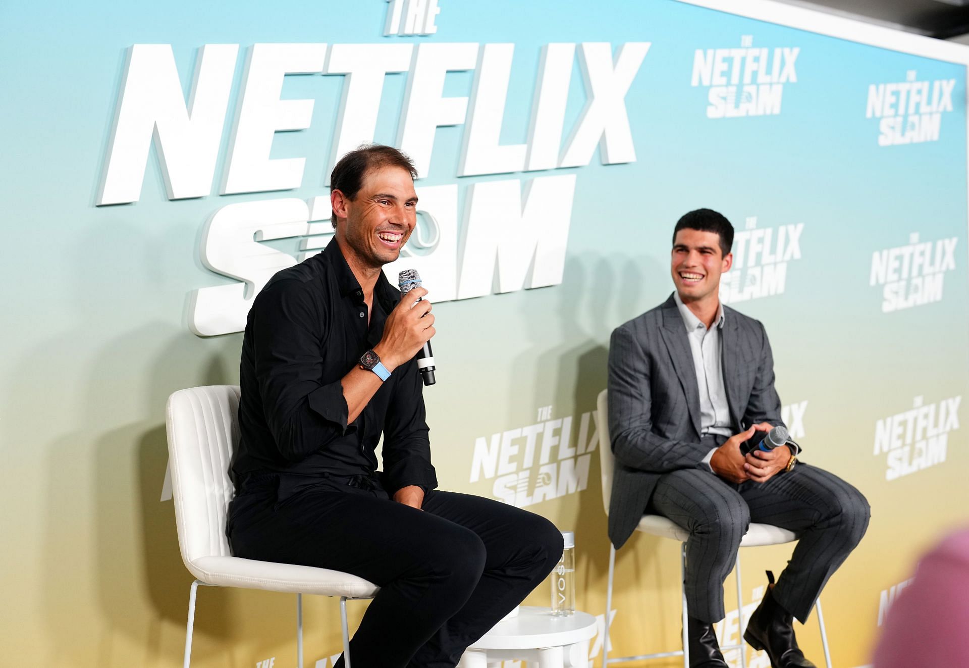 Rafael Nadal and Carlos Alcaraz speak onstage during The Netflix Slam media availability event at Mandalay Bay Resort and Casino