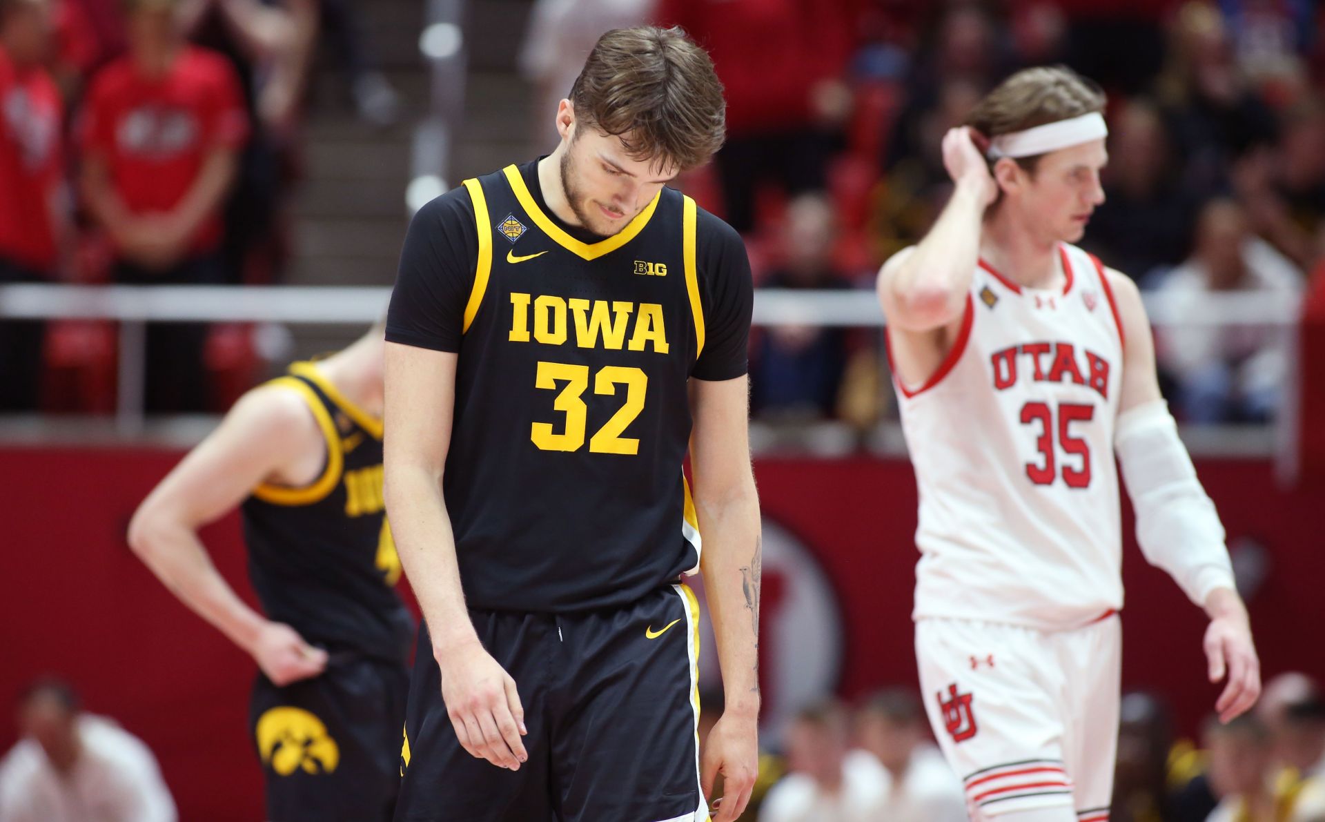 Owen Freeman #32 of the Iowa Hawkeyes reacts as he walks up the court.