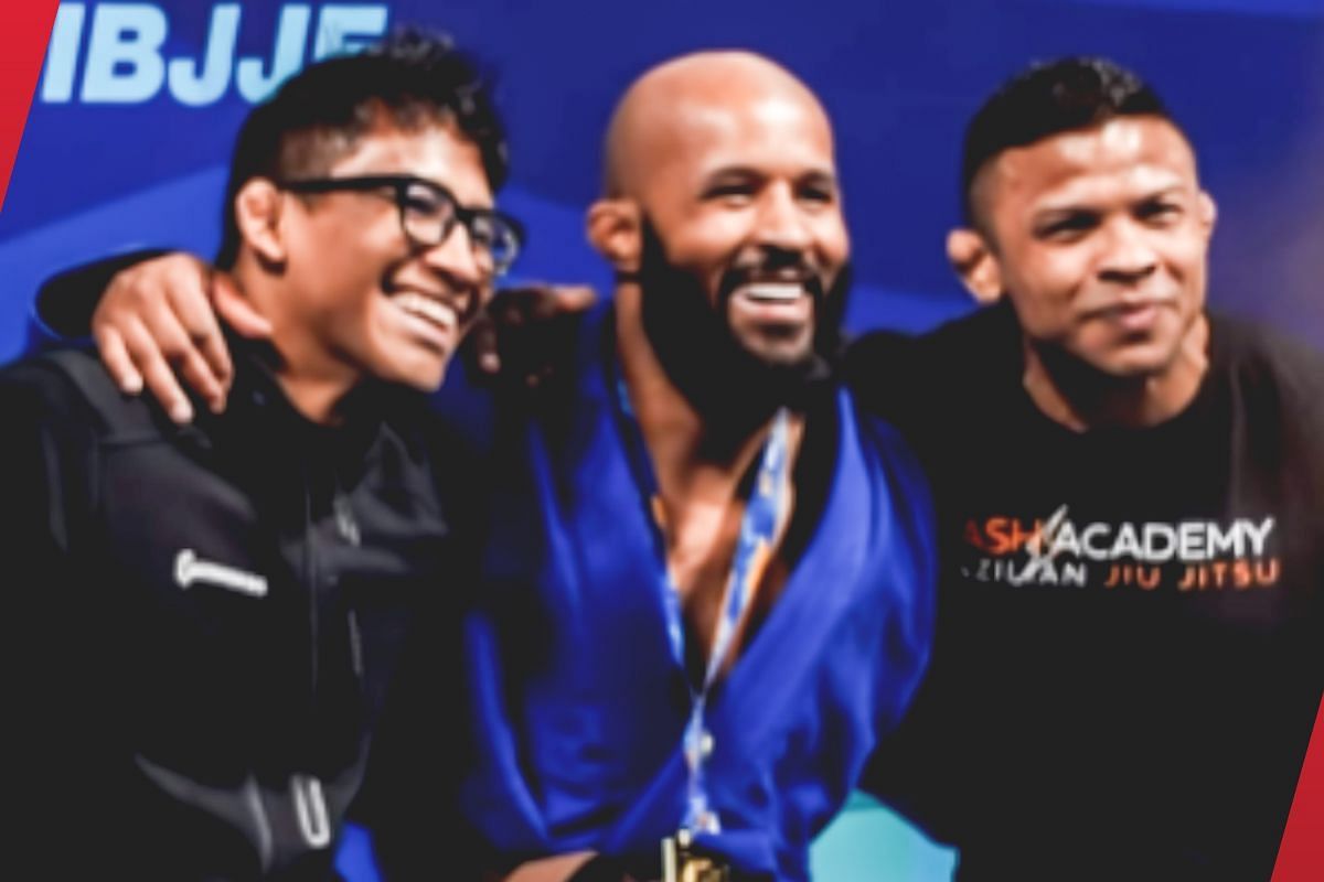 Demetrious Johnson celebrating his victory with teammates