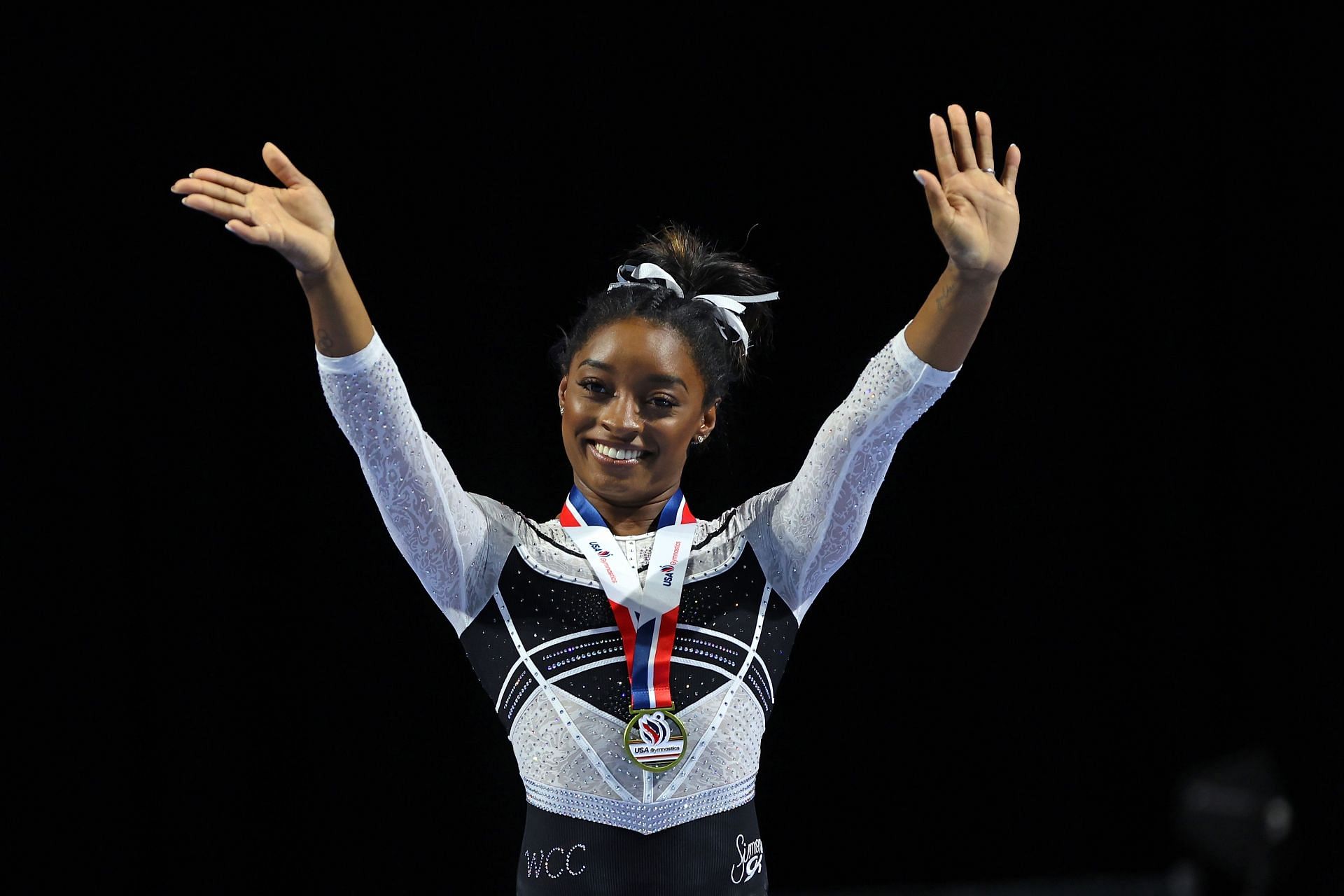 Simone Biles celebrates after winning the all-around at the Core Hydration Classic at Now Arena on August 05, 2023 in Hoffman Estates, Illinois. (Photo by Stacy Revere/Getty Images)