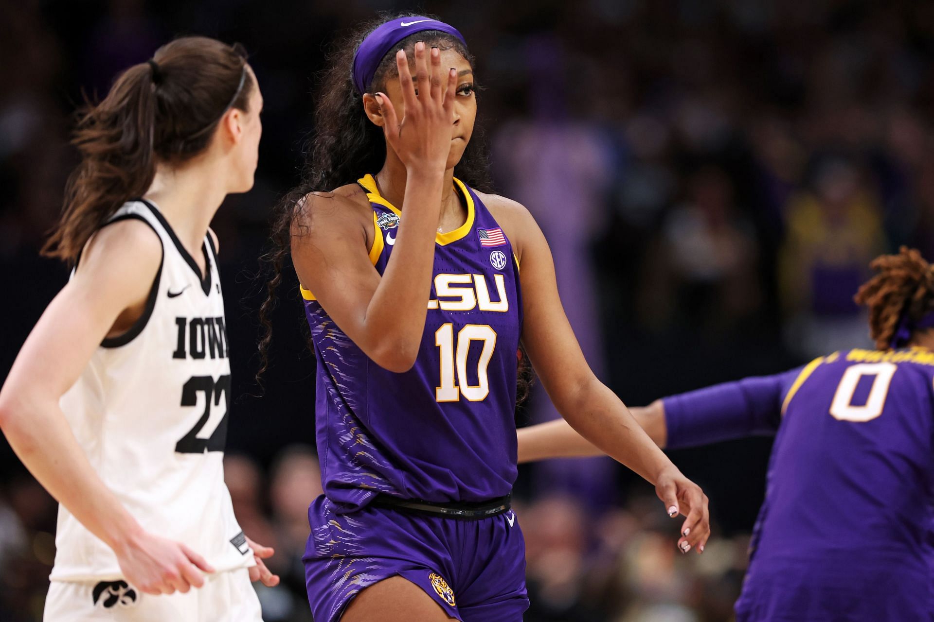 Angel Reese #10 of the LSU Lady Tigers reacts towards Caitlin Clark #22 of the Iowa Hawkeyes during the fourth quarter during the 2023 NCAA Women&#039;s Basketball Tournament championship game.
