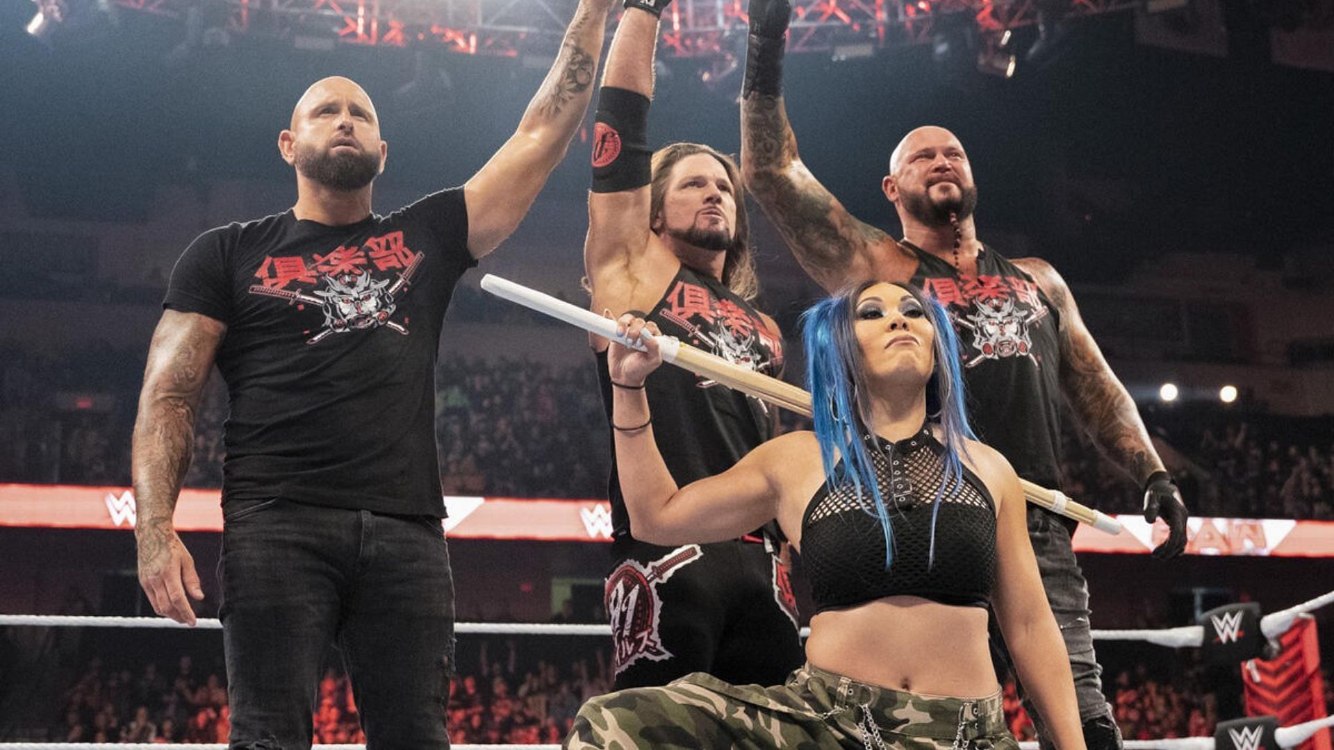 The WWE rendition of Bullet Club features (from left to right) Karl Anderson, AJ Styles, Mia Yim and Luke Gallows [Credit: WWE]