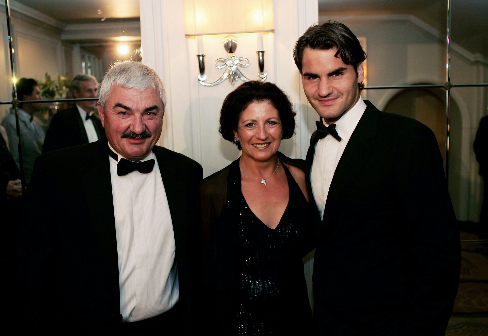 Roger Federer poses with his parents during 2005 Wimbledon Winners Dinner