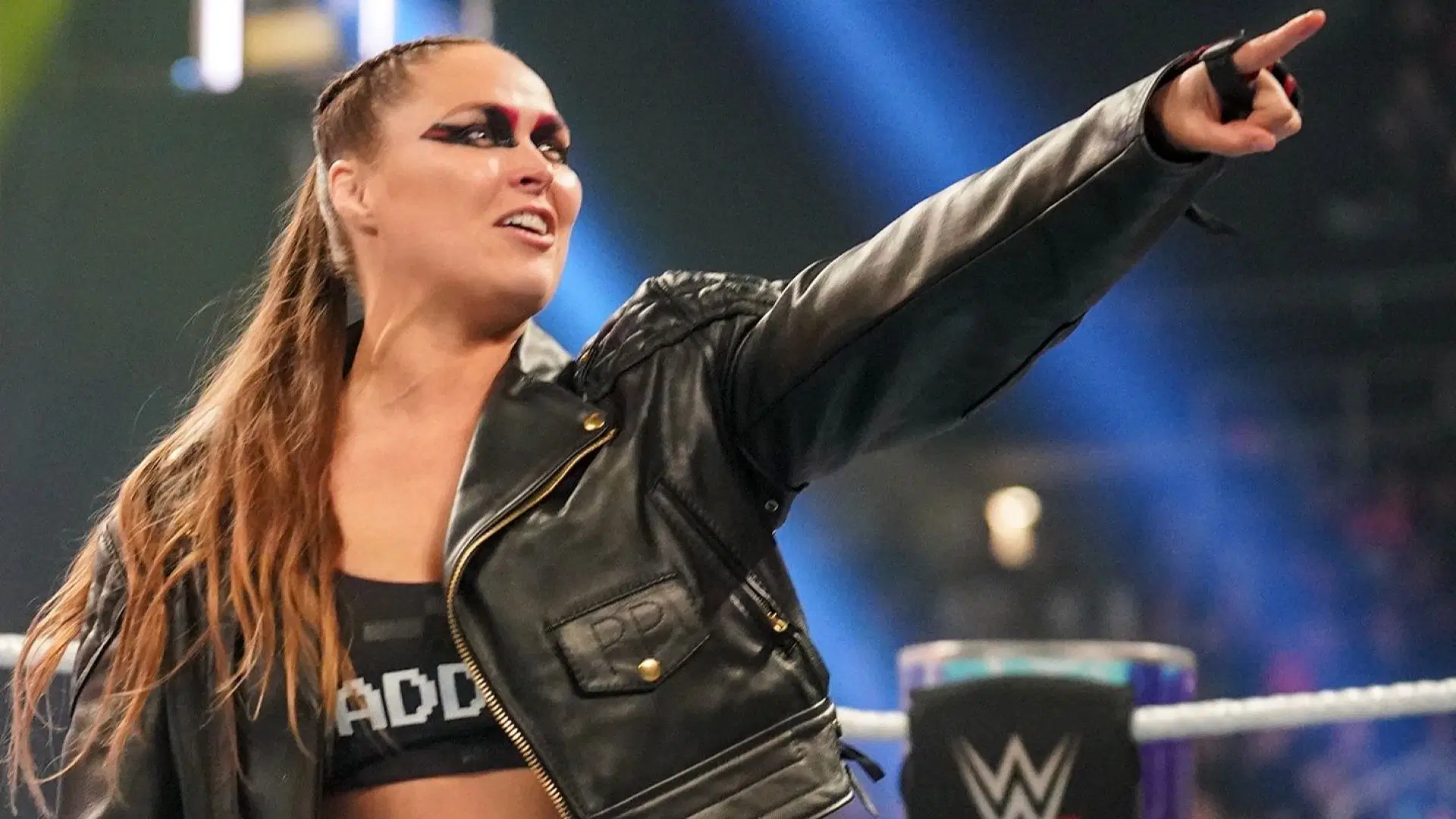 Ronda Rousey points to a WrestleMania 38 sign on WWE RAW