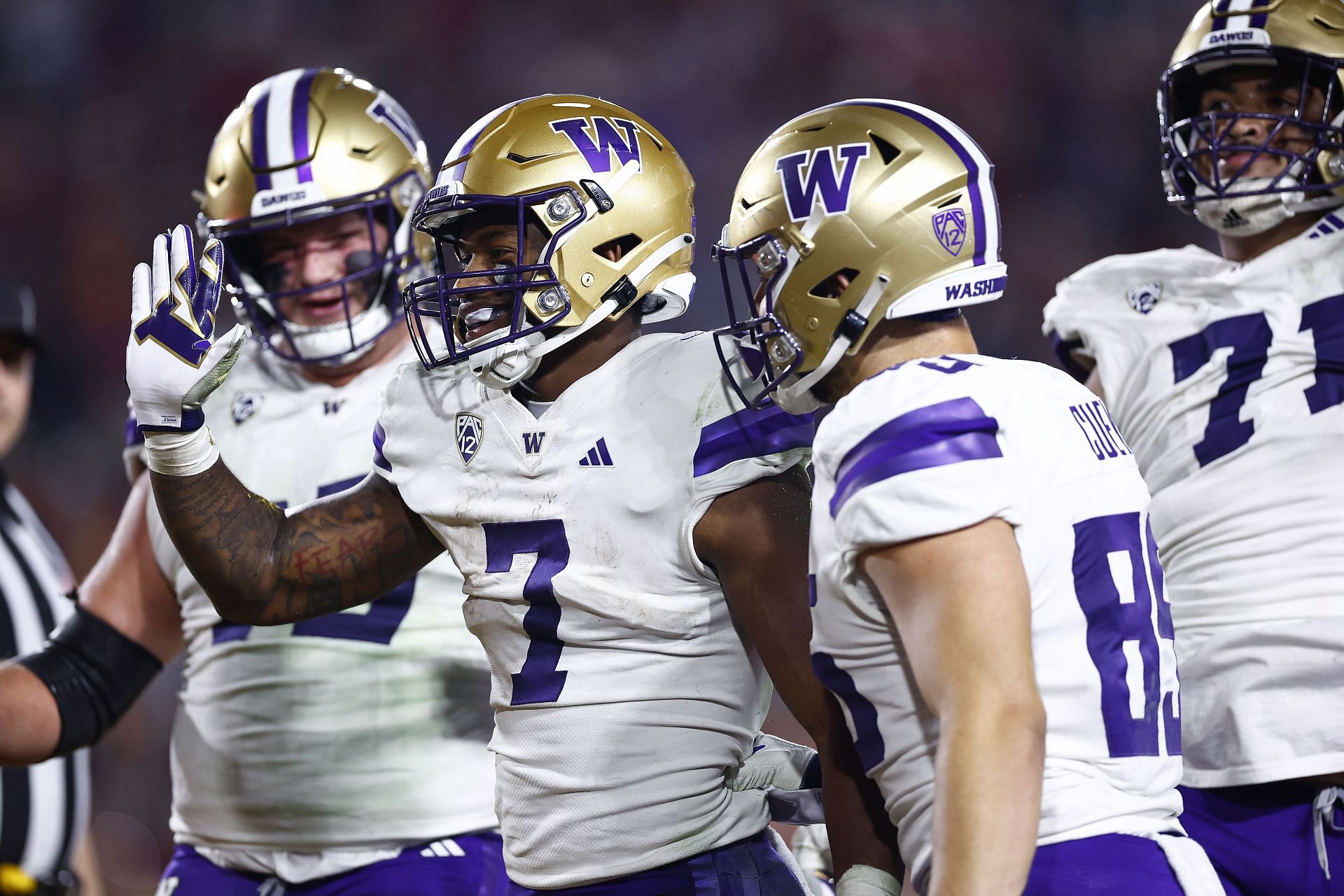 Dillon Johnson #7 of the Washington Huskies celebrates a touchdown against the USC Trojans