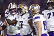 Dillon Johnson #7 of the Washington Huskies celebrates a touchdown against the USC Trojans