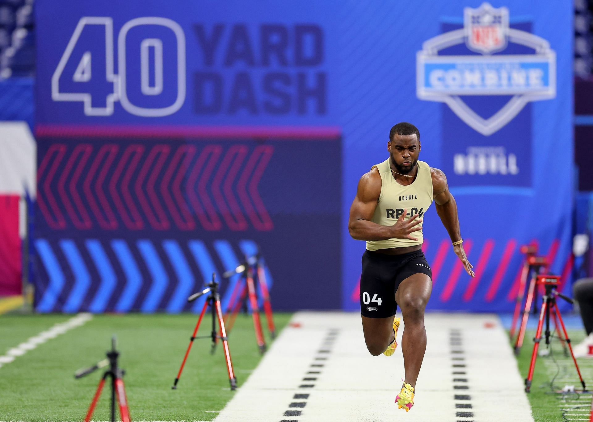 Trey Benson #RB04 of Florida State participates in the 40-yard dash during the NFL Combine
