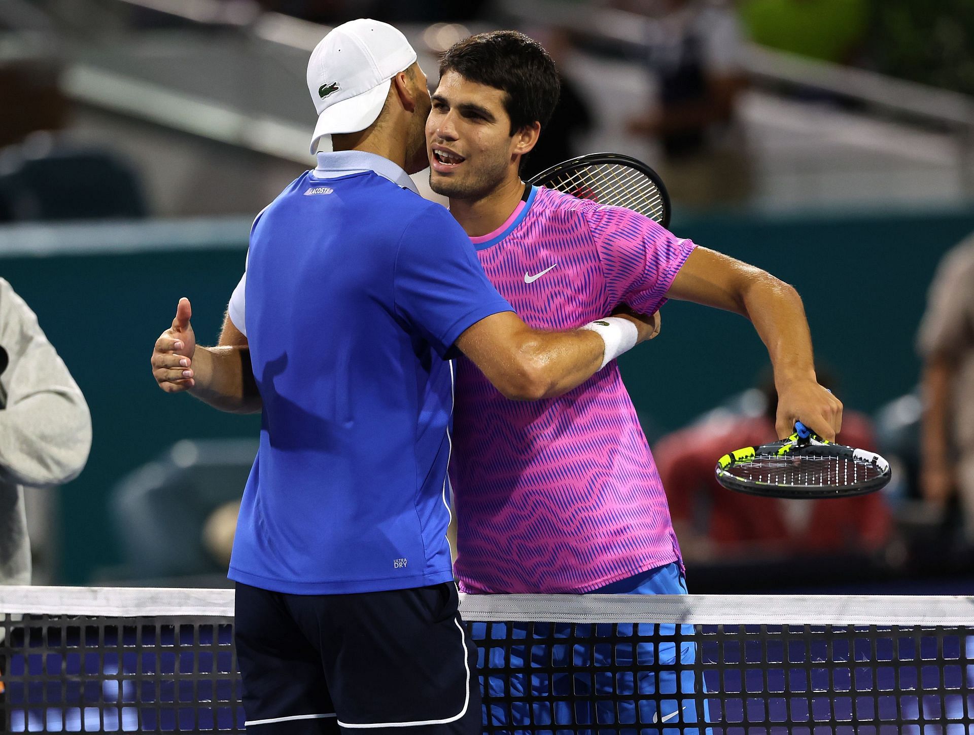Grigor Dimitrov and Carlos Alcaraz embrace at the net following Miami clash