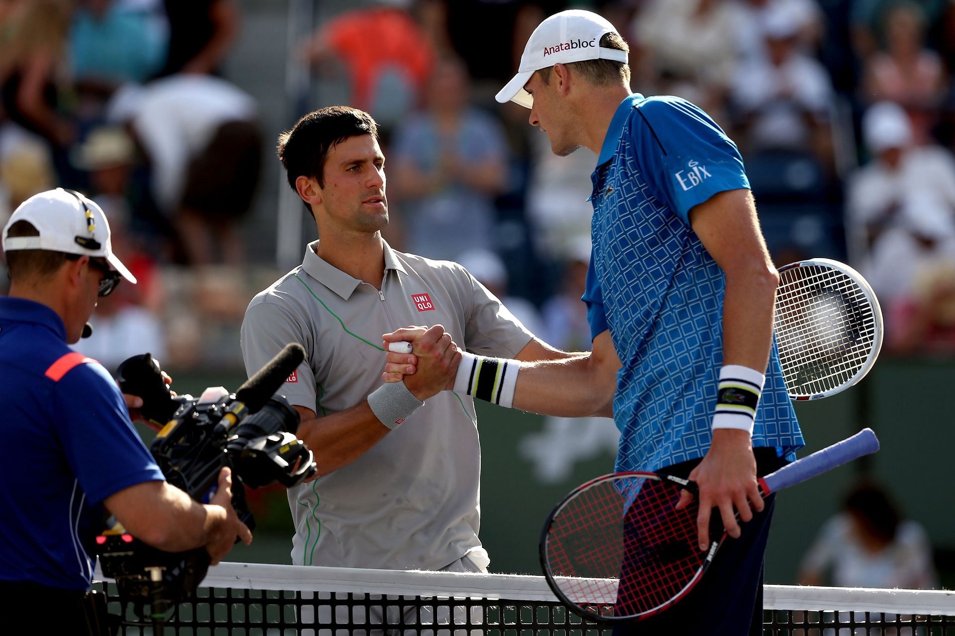 Novak Djokovic (L) and John Isner (R) at the 2014 Indian Wells Masters