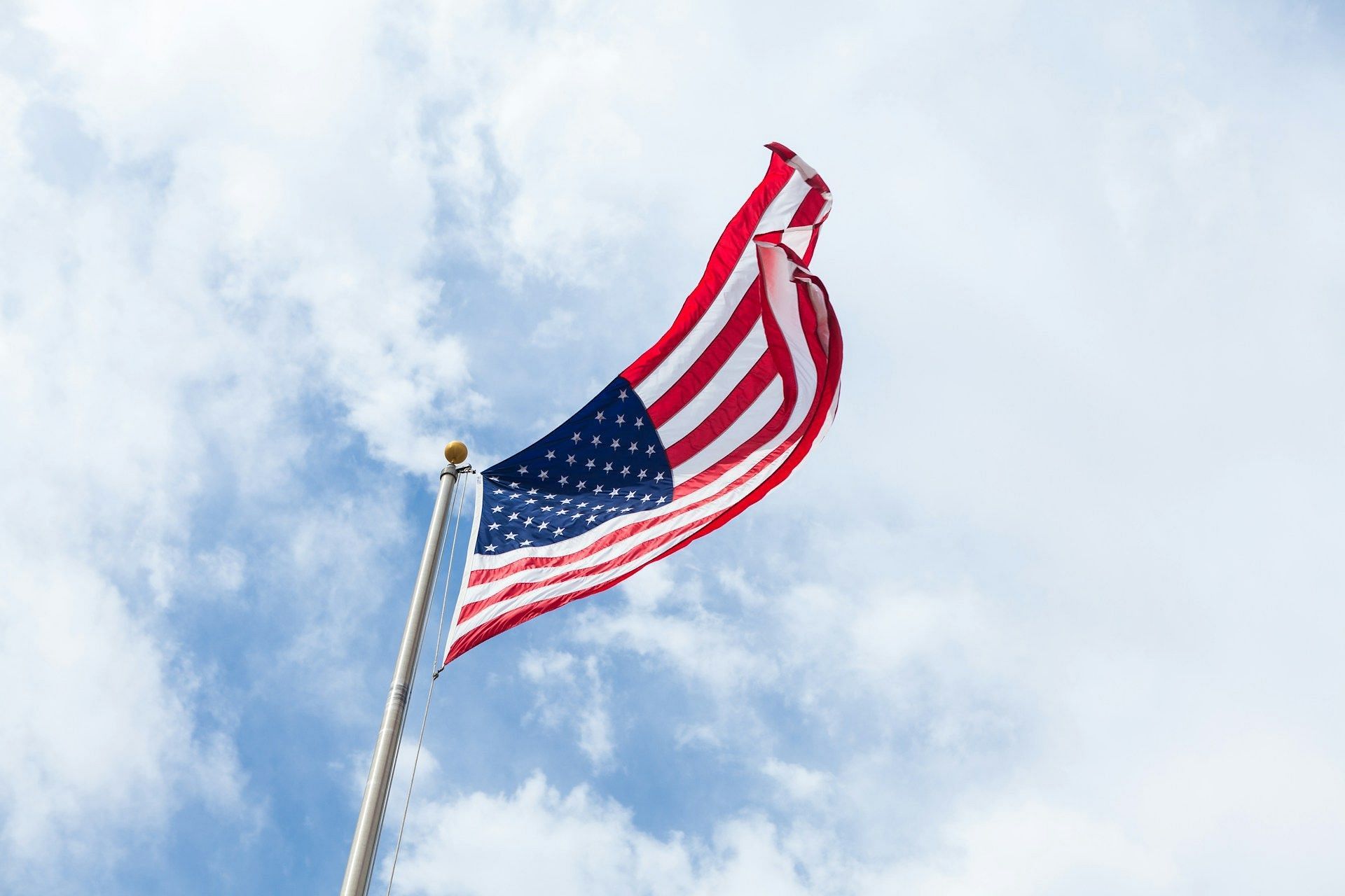 A representative image of the American flag is used. (Image via Unsplash)