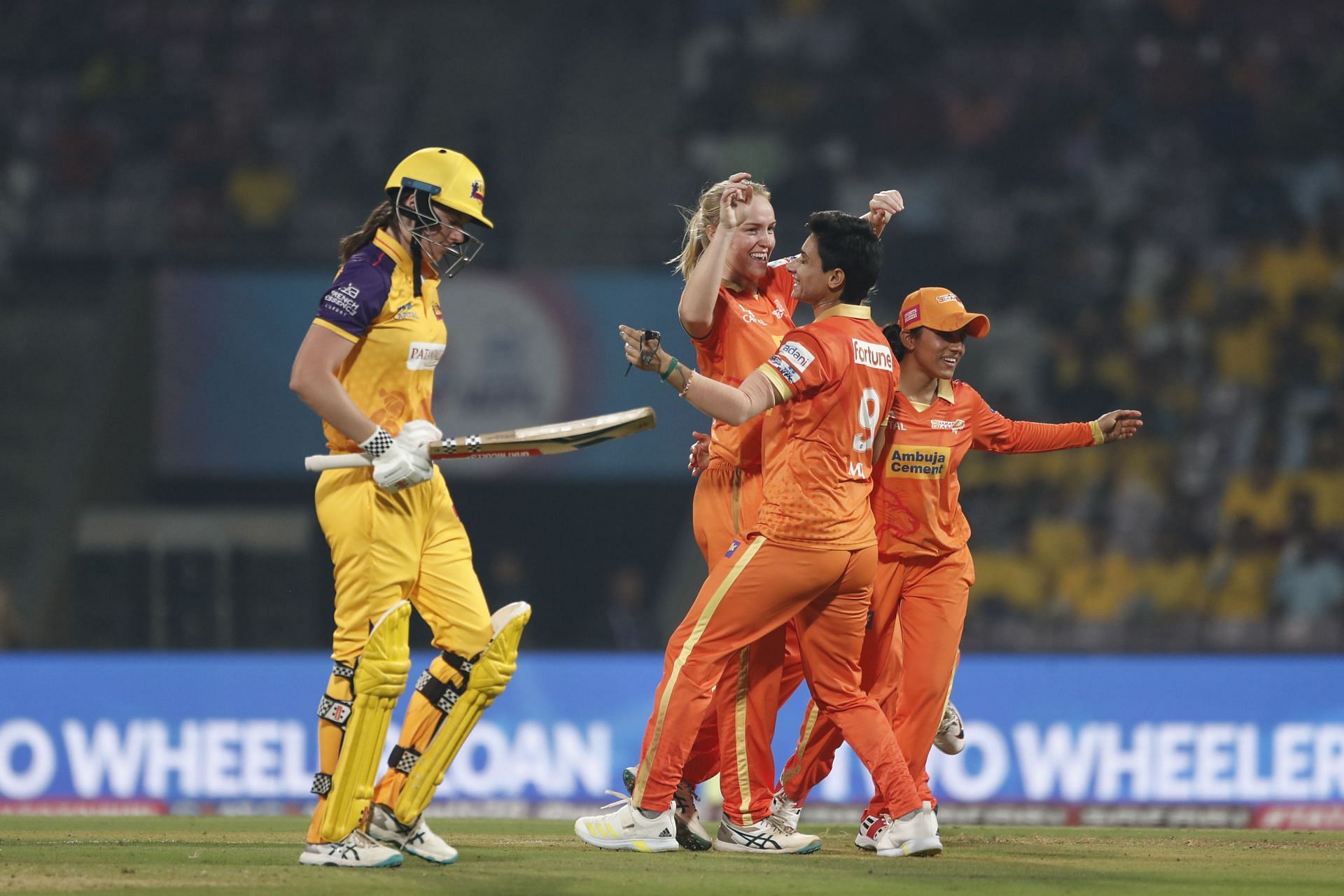 Tahlia McGrath walks off after being dismissed in a match against Gujarat Giants.