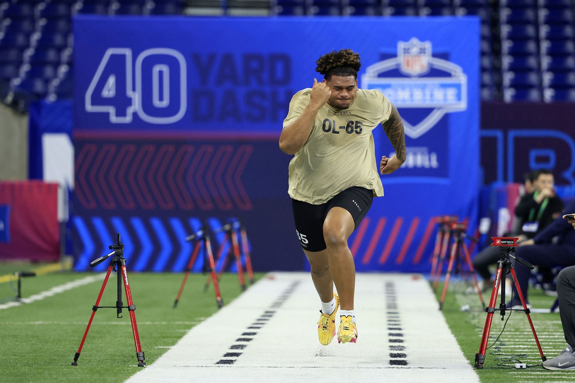 Kingsley Suamataia #OL65 of Brigham Young participates in the 40-yard dash during the NFL Combine 