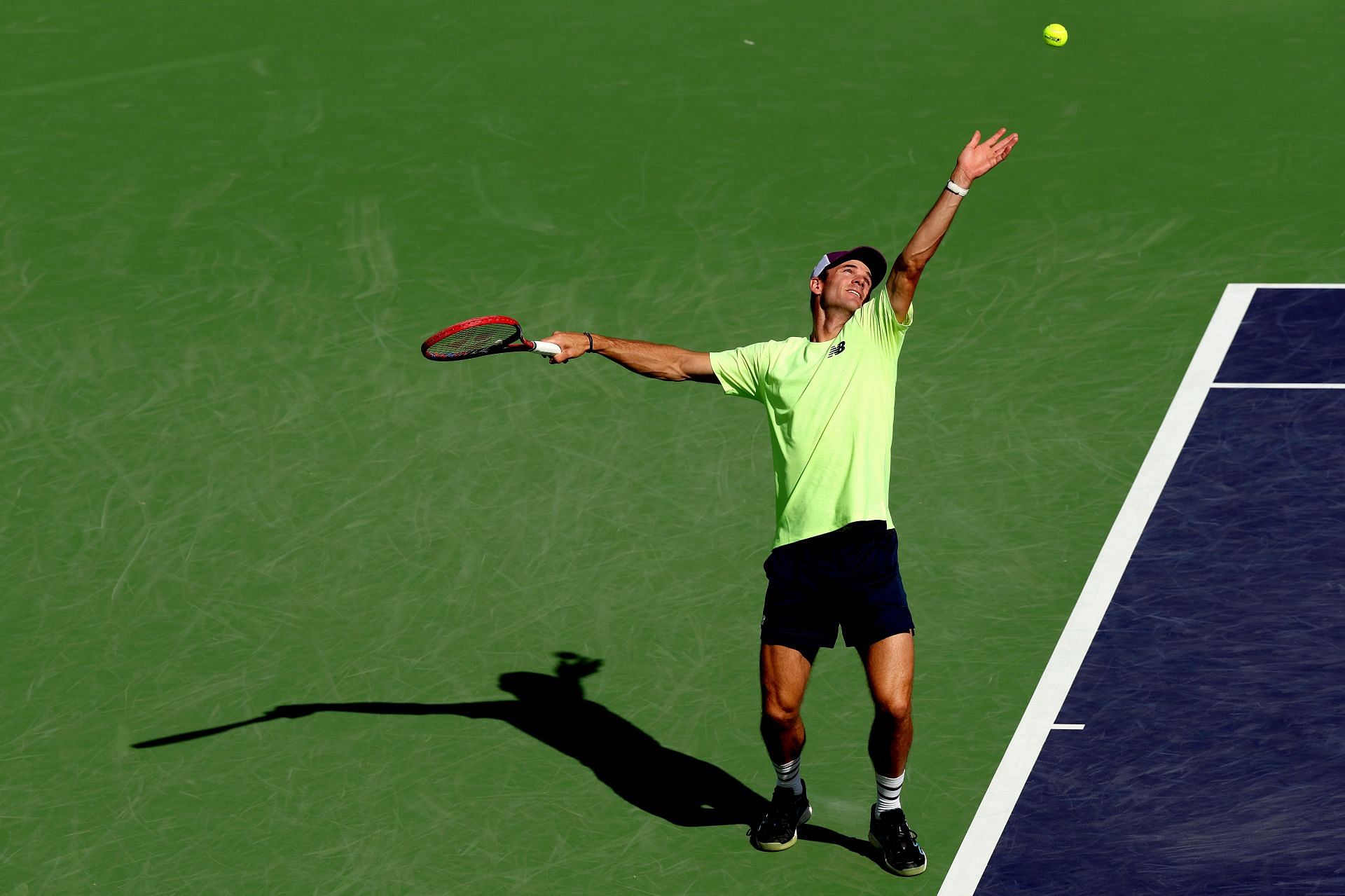 Tommy Paul serves at the Indian Wells