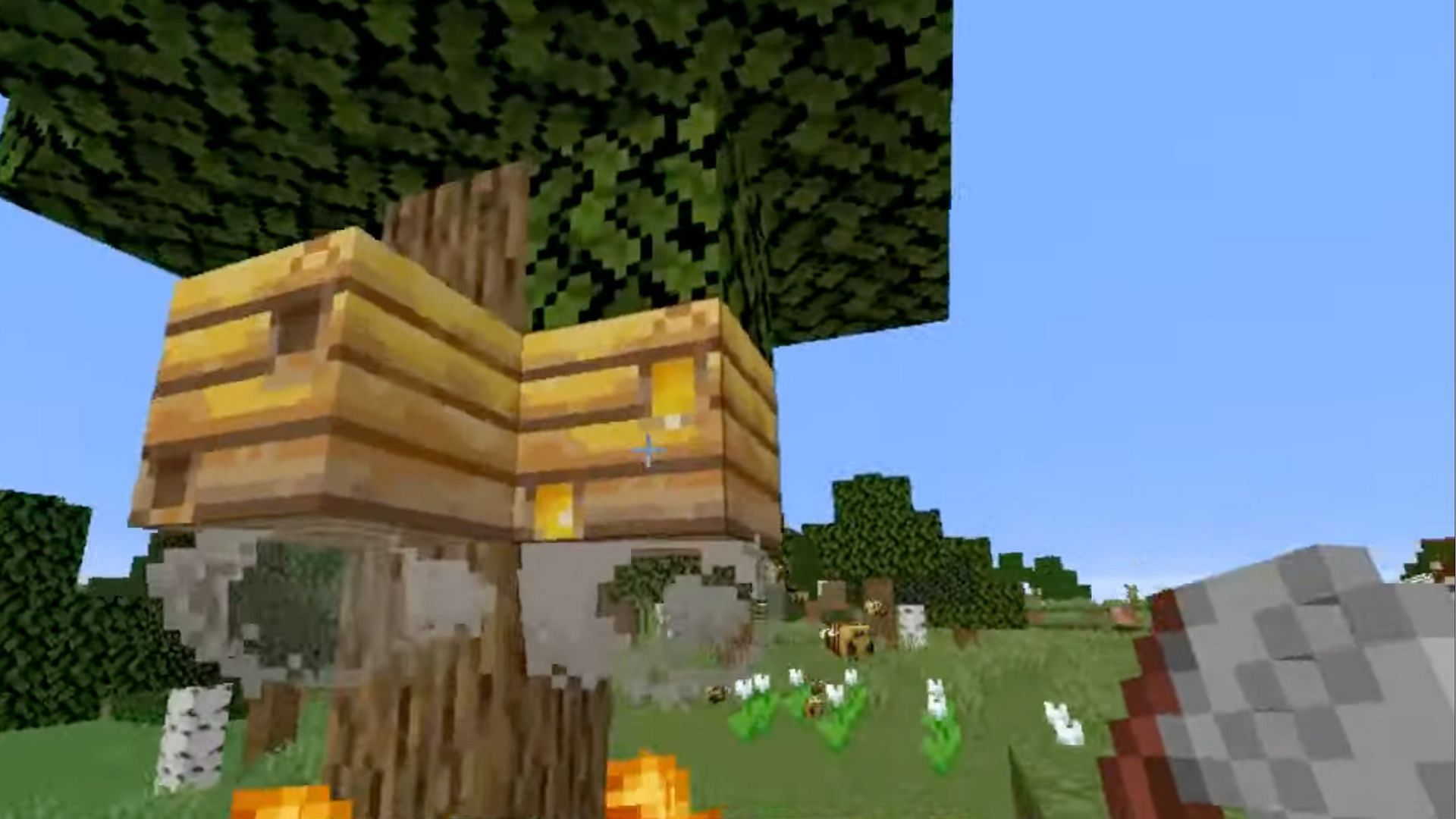 Shears can be used on the beehive to get honeycomb. (Image via YouTube/MonkeyKingHero)