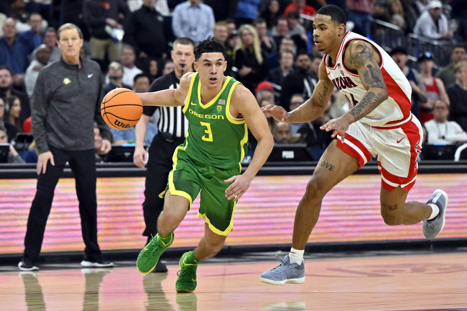 Jackson Shelstad #3 drives to the basket. Shelstad made two free throws in the final seconds to give Oregon a 67-59 win over Arizona in the Pac-12 Tournament semifinal.