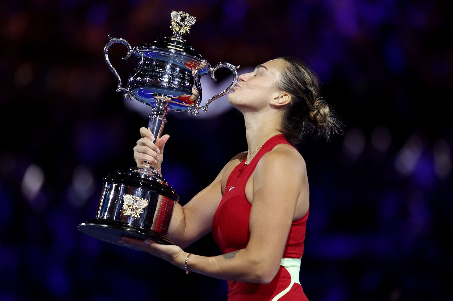 Aryna Sabalenka poses with the 2024 Australian Open trophy