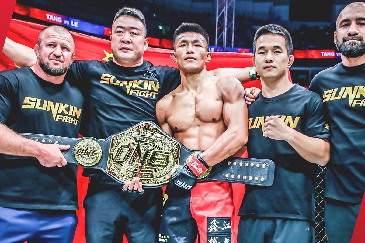 Tang Kai celebrates his win with his team | Image credit: ONE Championship