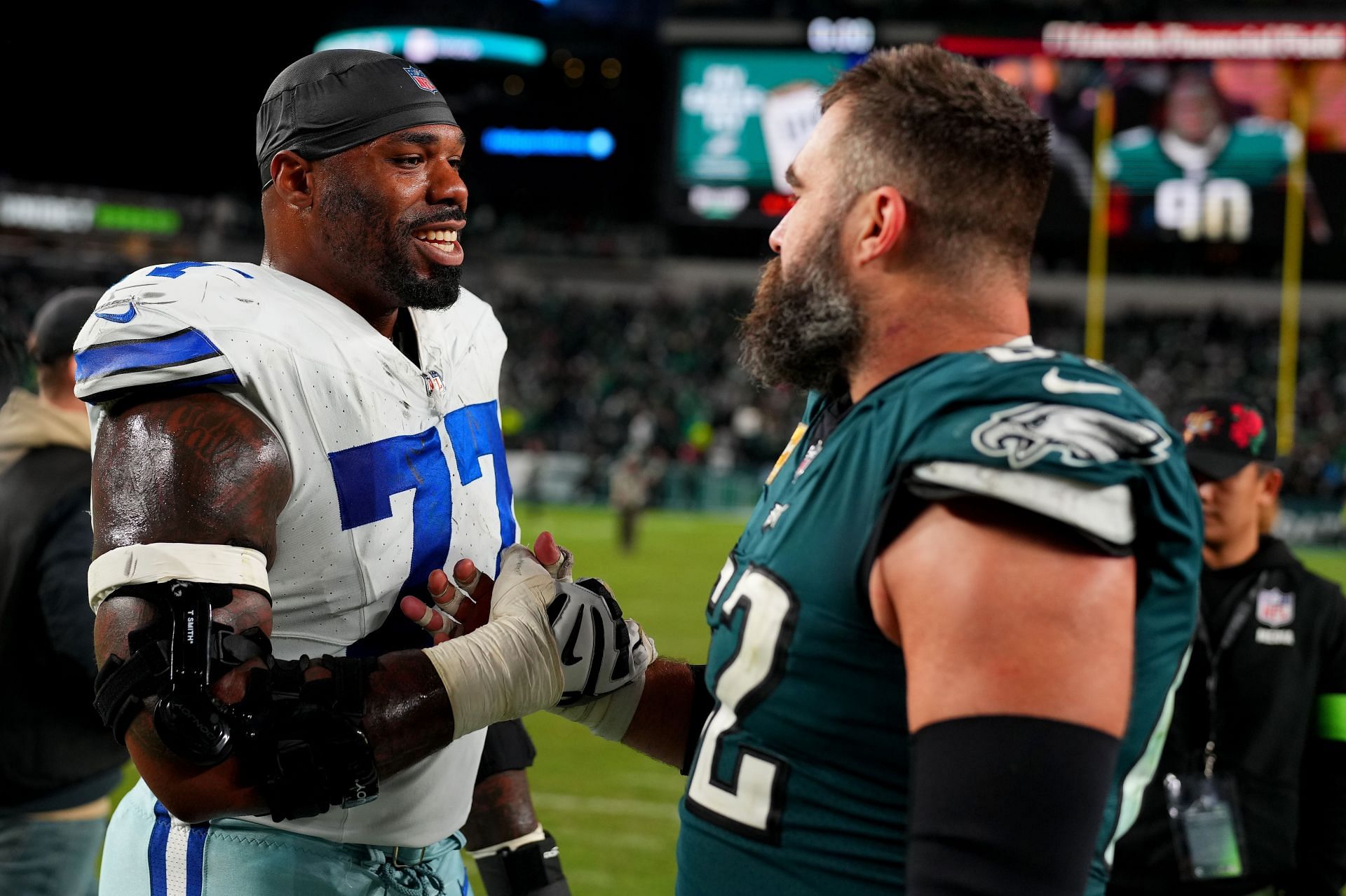 Tyron Smith (left, #77) with Jason Kelce