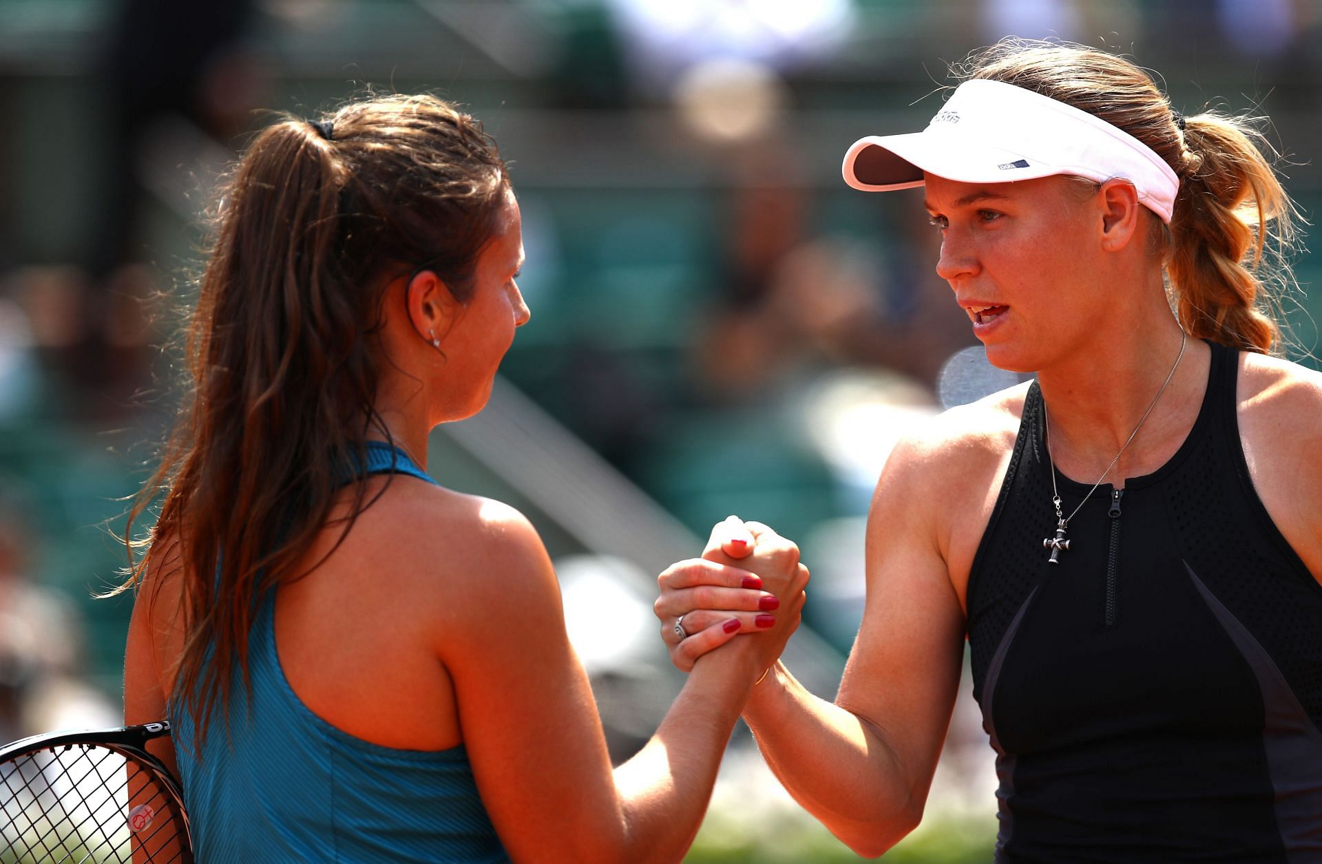 Daria Kasatkina and Caroline Wozniacki at the 2018 French Open