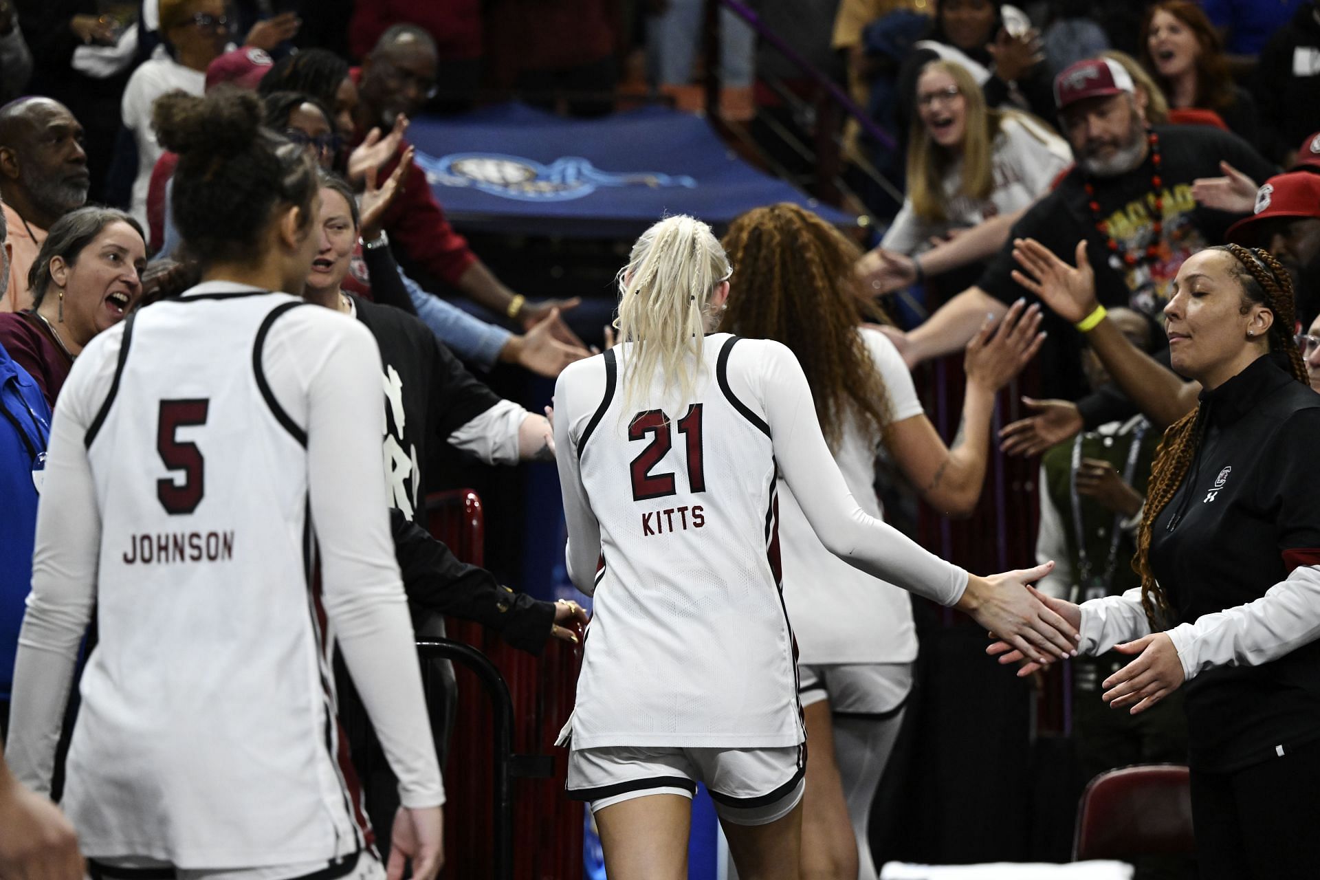 South Carolina players Tessa Johnson #5, Chloe Kitts #21, and Kamilla Cardoso #10 are ejected from the game