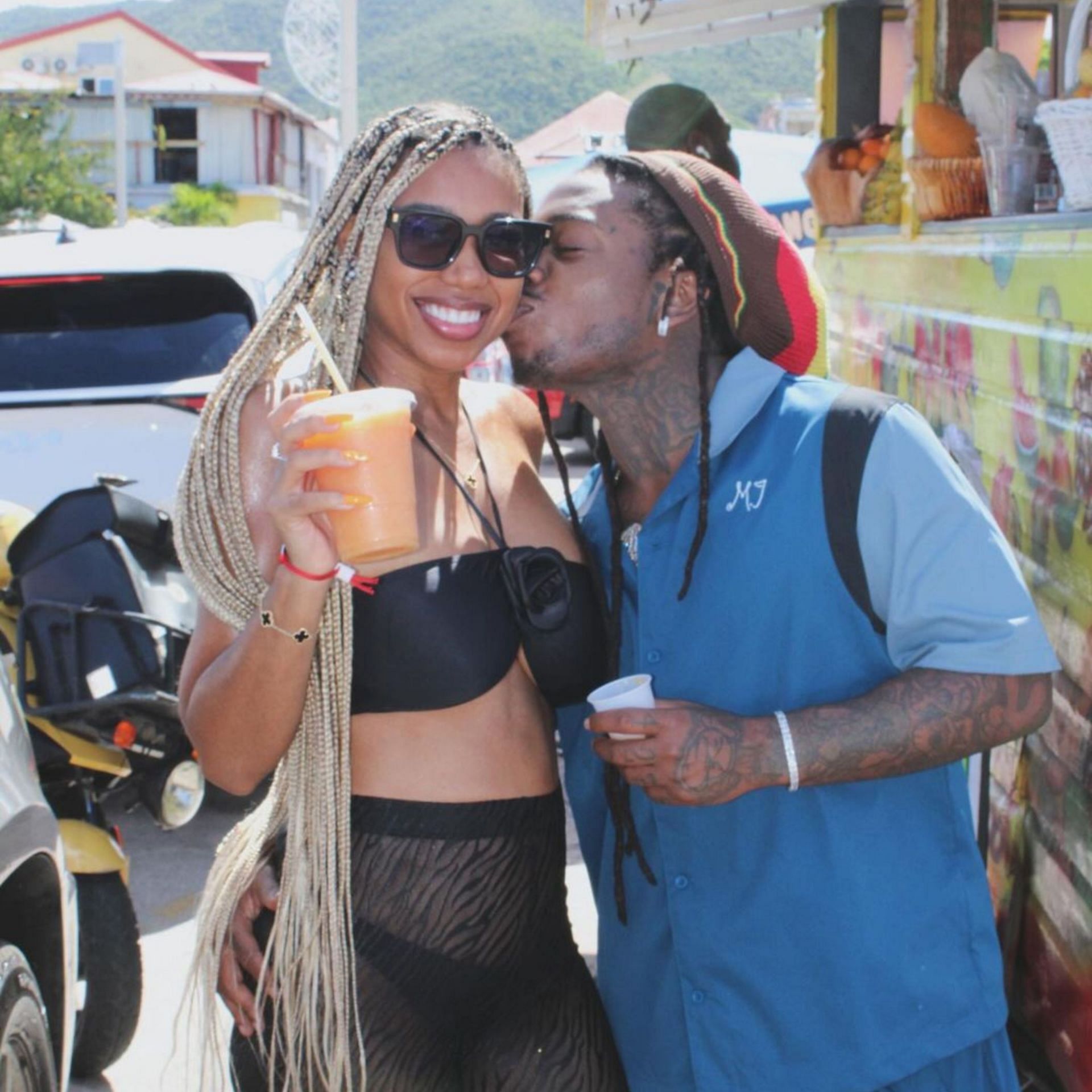 Jacquees and Deiondra are sharing a moment.