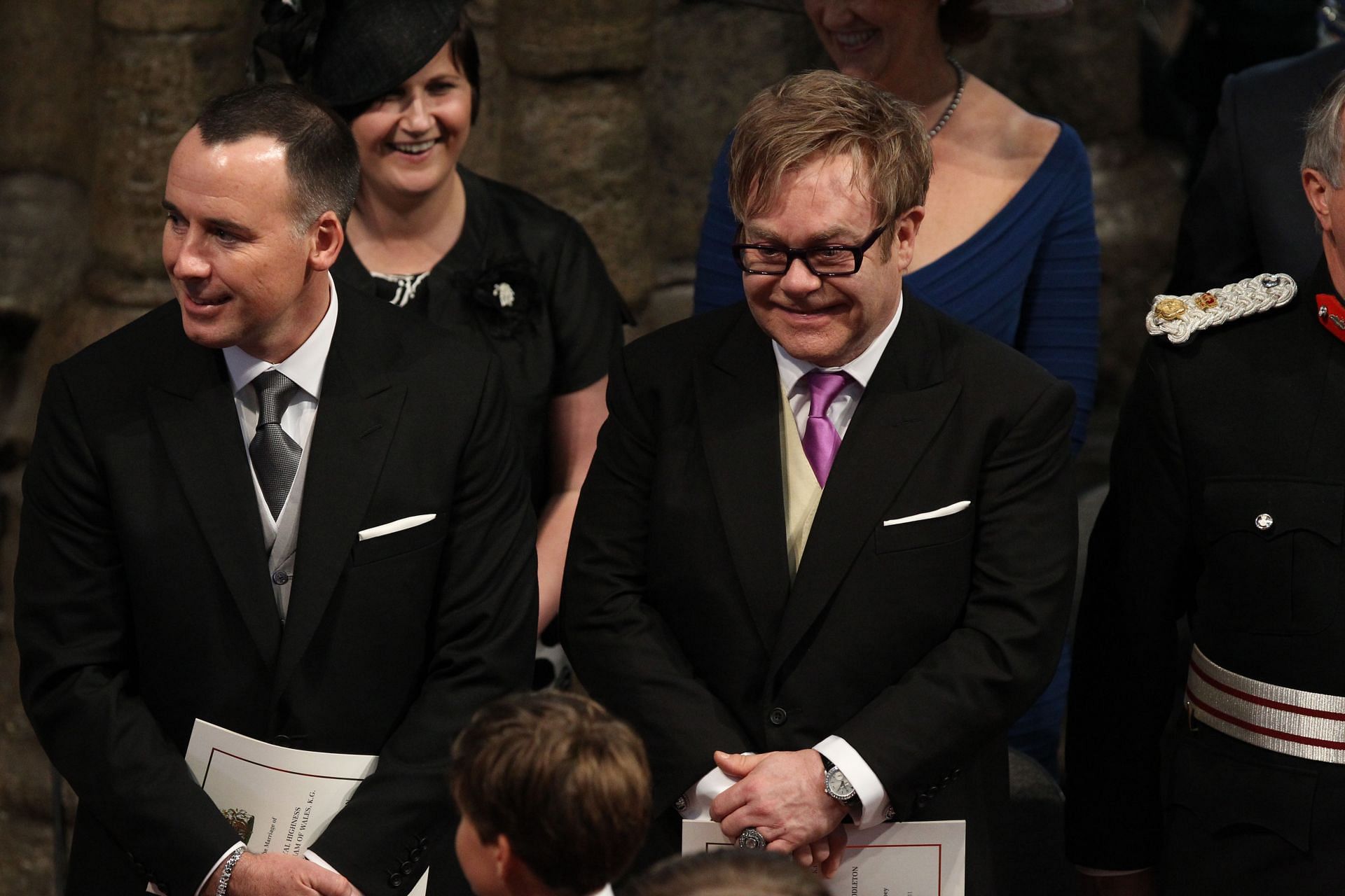 Elton John (C) and partner David Furnish (L) attend the Royal Wedding of Prince William to Catherine Middleton (Source: Getty)