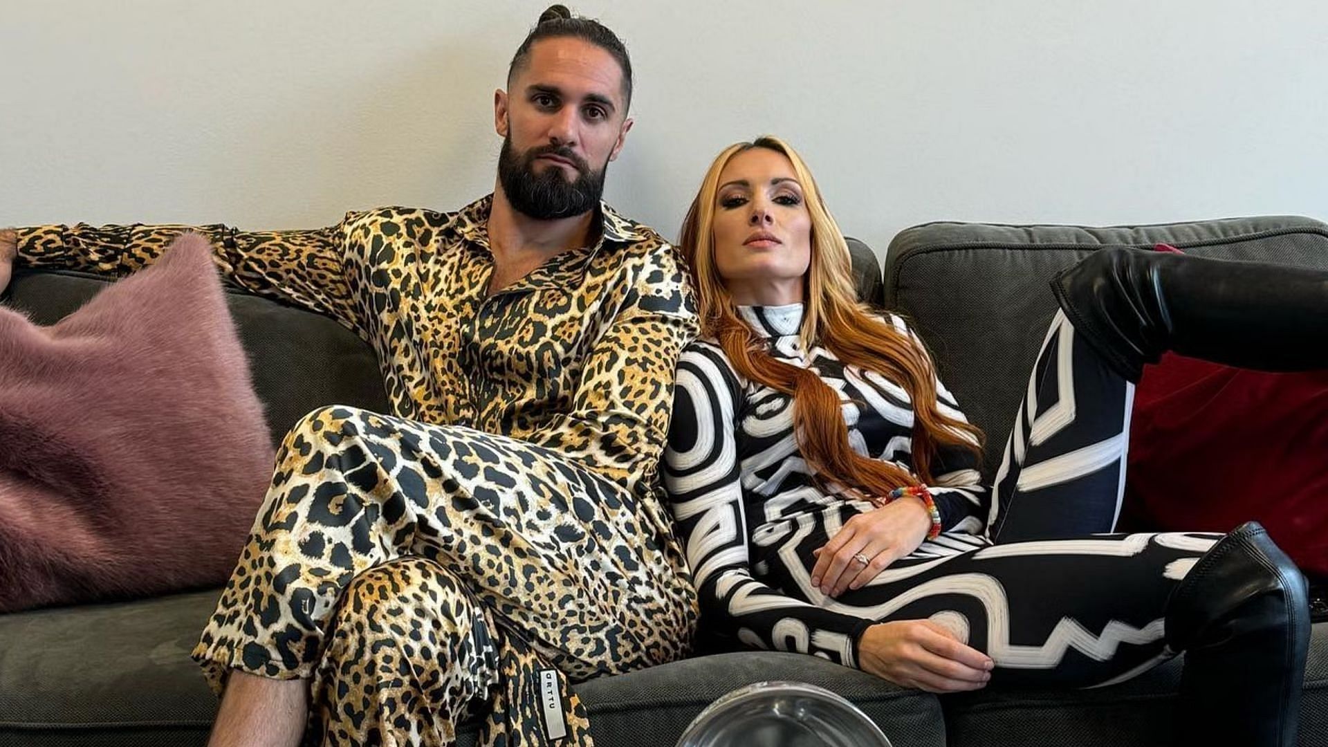 WWE Superstars Becky Lynch and Seth Rollins pose for a photo shoot