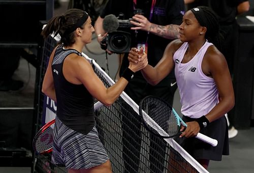 Caroline Garcia (L) and Coco Gauff shake hands