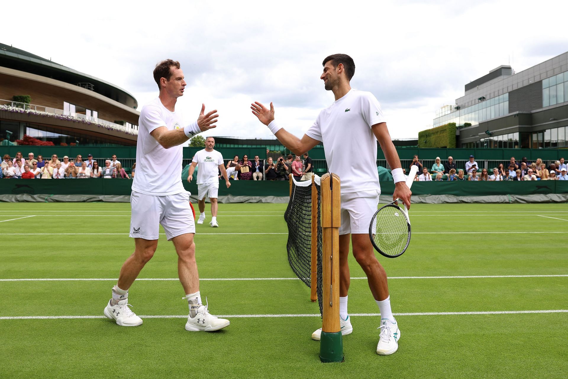 Andy Murray (L) and Novak Djokovic (R) after a practice session at the 2023 Wimbledon Championships