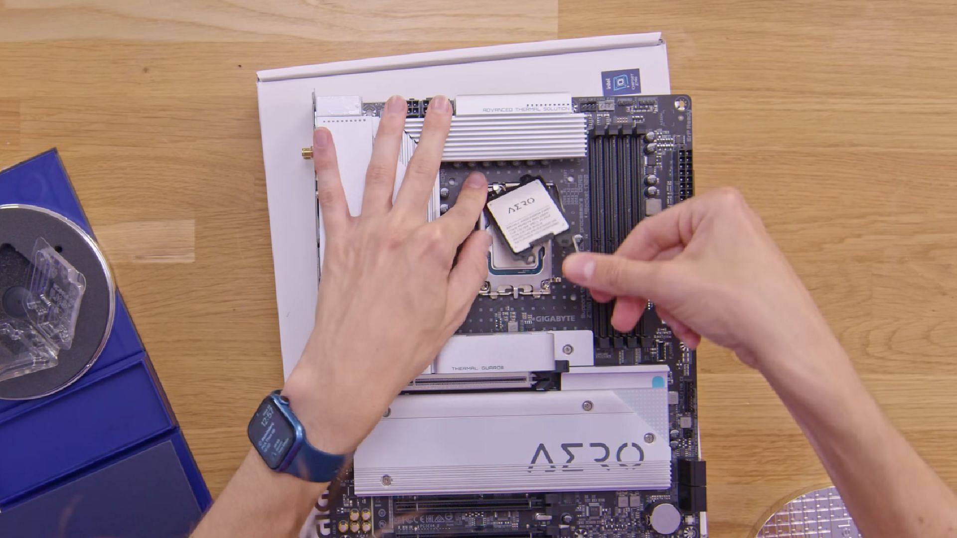 Adding the CPU to the motherboard (Image via PC Centric/YouTube)