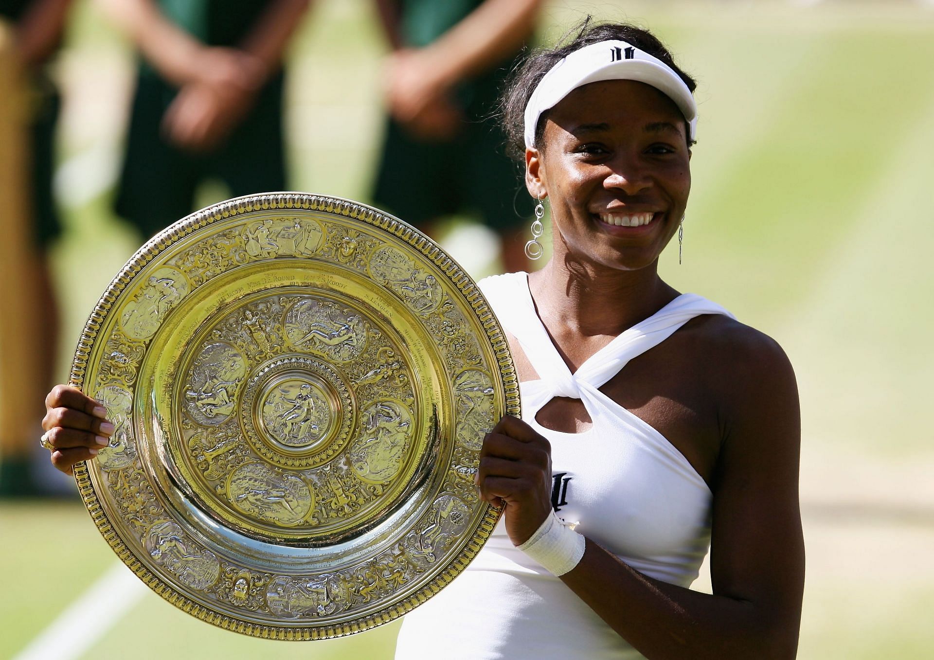 Venus Williams pictured with her last Wimbledon trophy in 2008