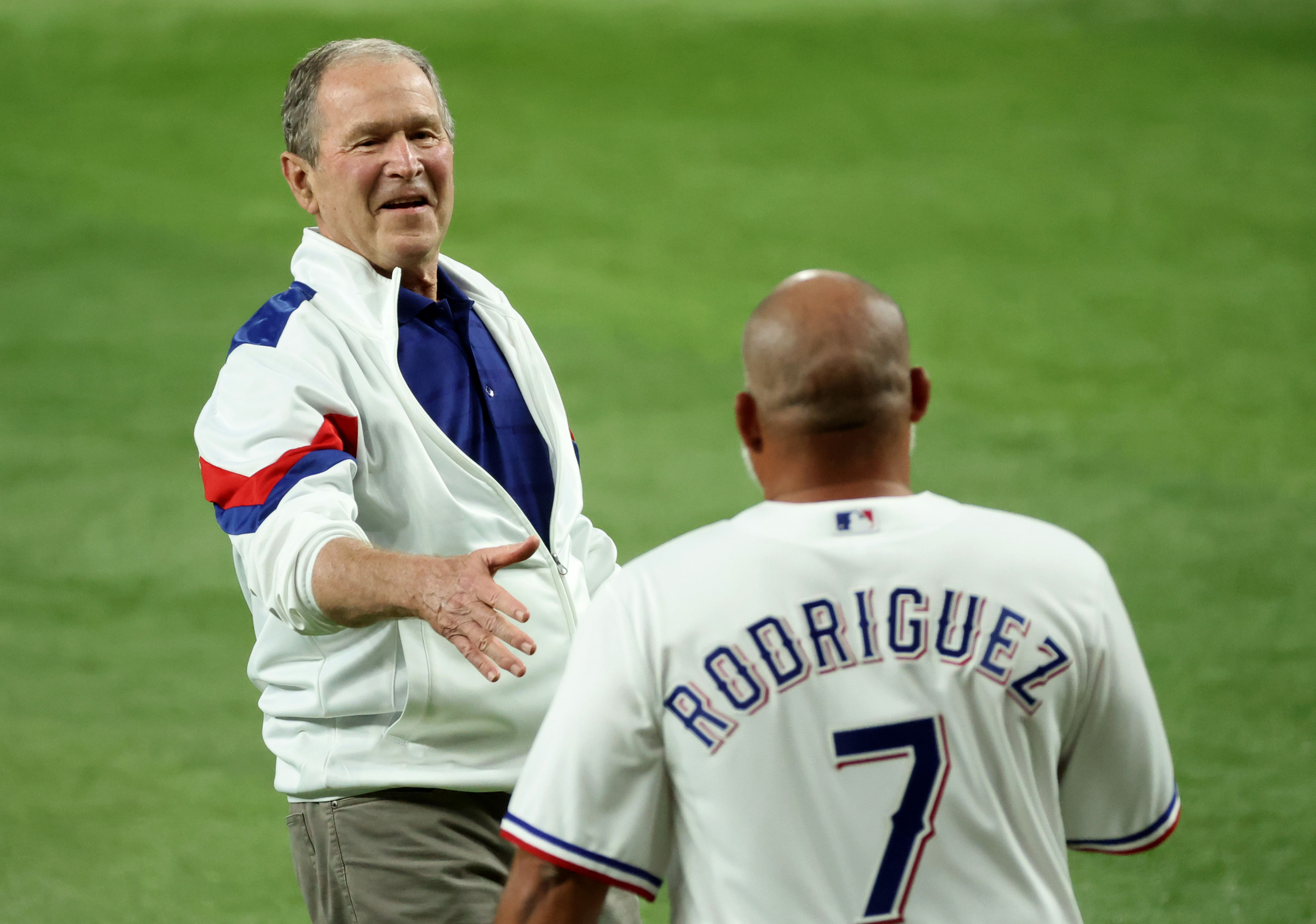 George W. Bush and Ivan Rogriguez (Image via USA Today)