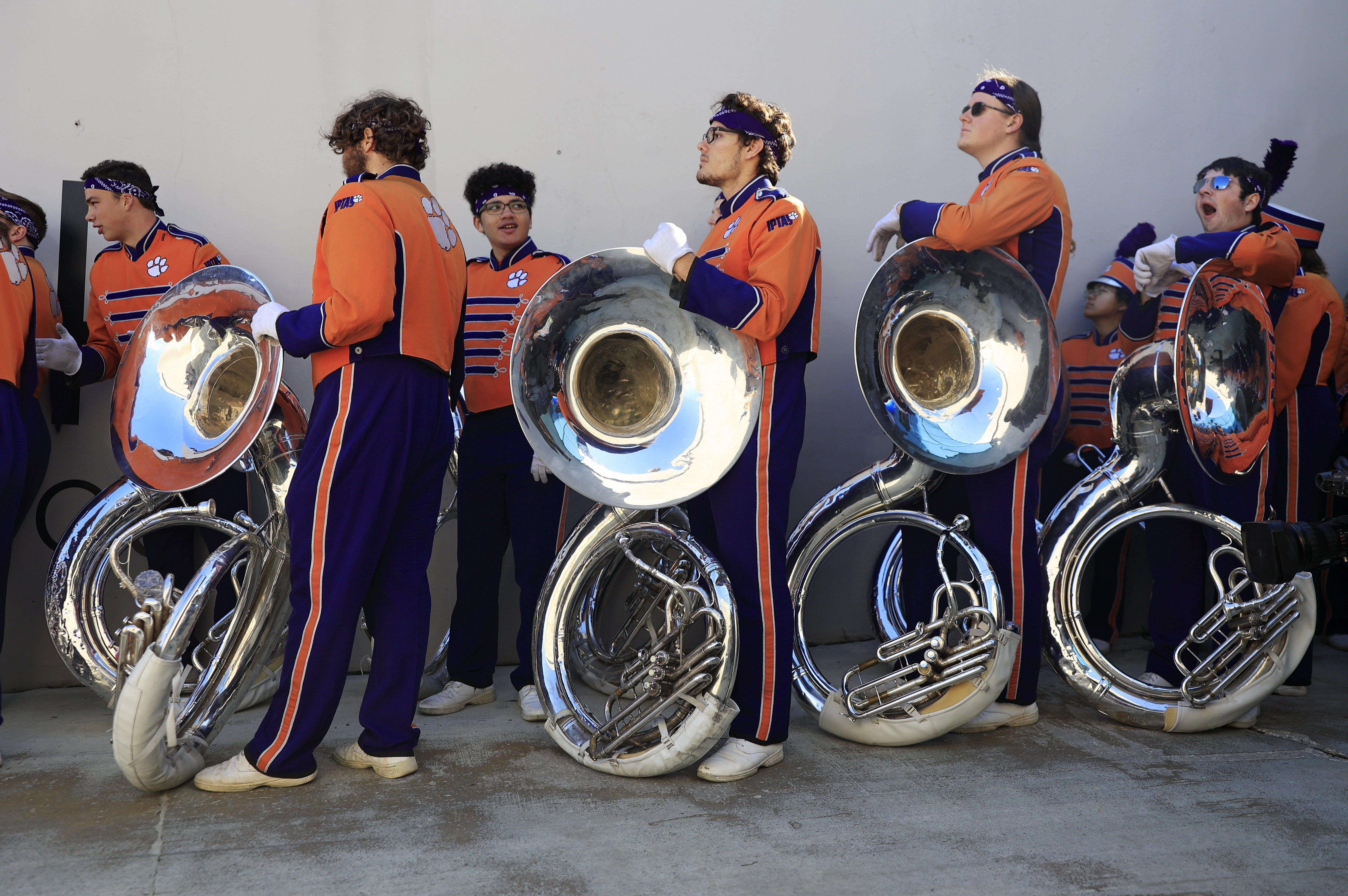 Clemson band members wait before the 2023 Gator Bowl, certain to unleash &quot;Tiger Rag&quot; on Clemson fans soon.