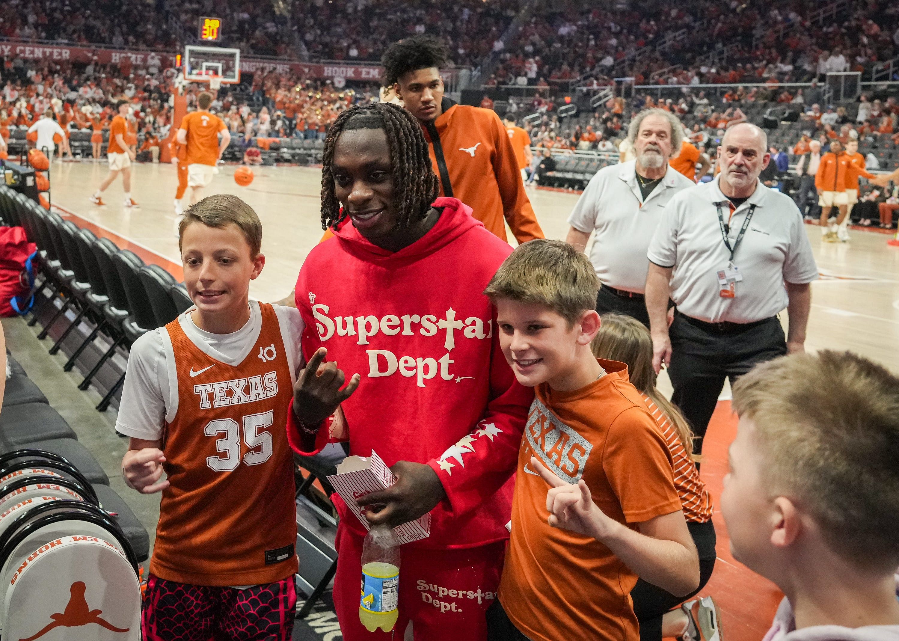 Xavier Worthy poses with fans ahead of 2024 NFL Draft