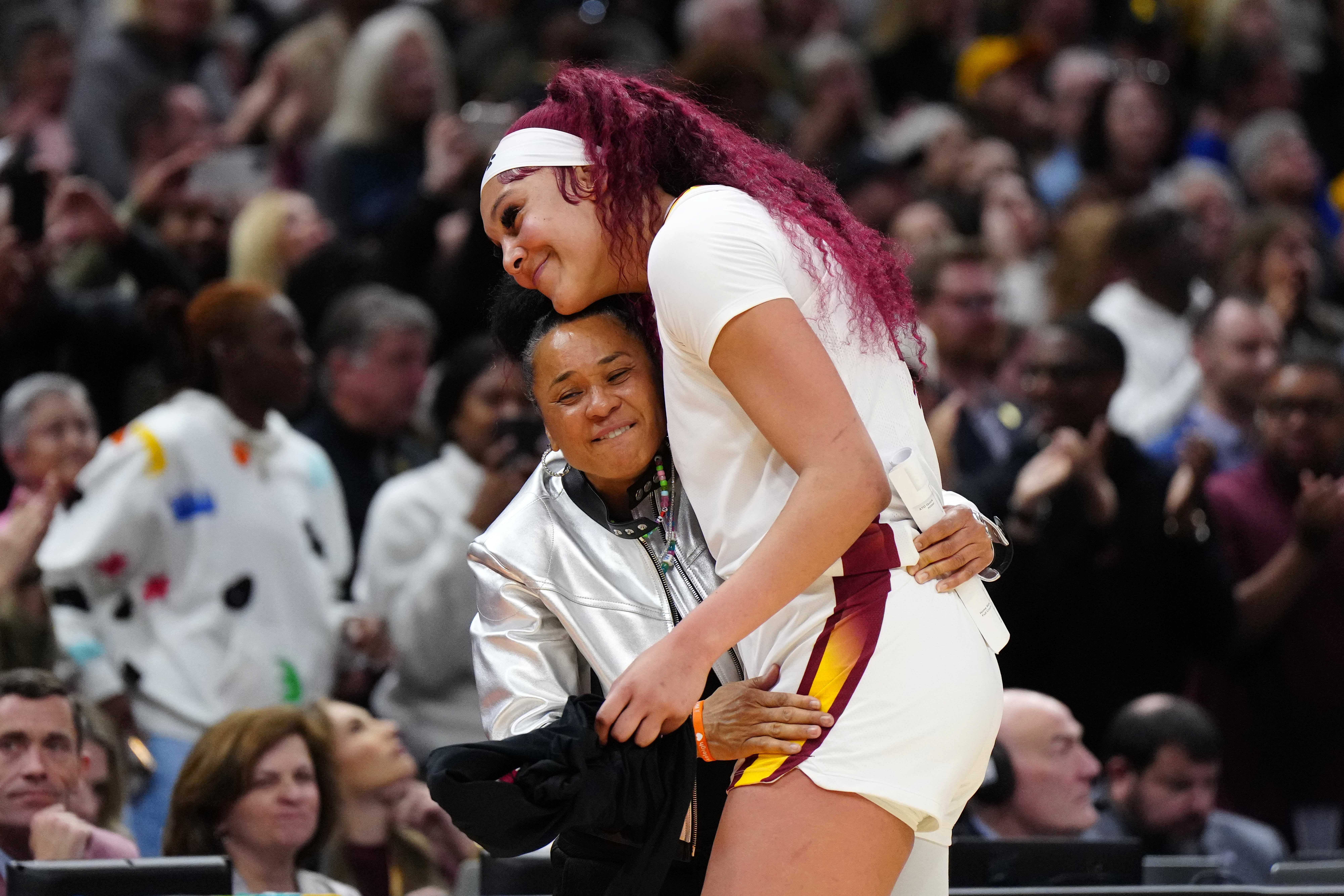Kamilla Cardoso hugged South Carolina coach Dawn Staley after the Gamecocks defeated the Iowa Hawkeyes in the NCAA women&#039;s basketball final.